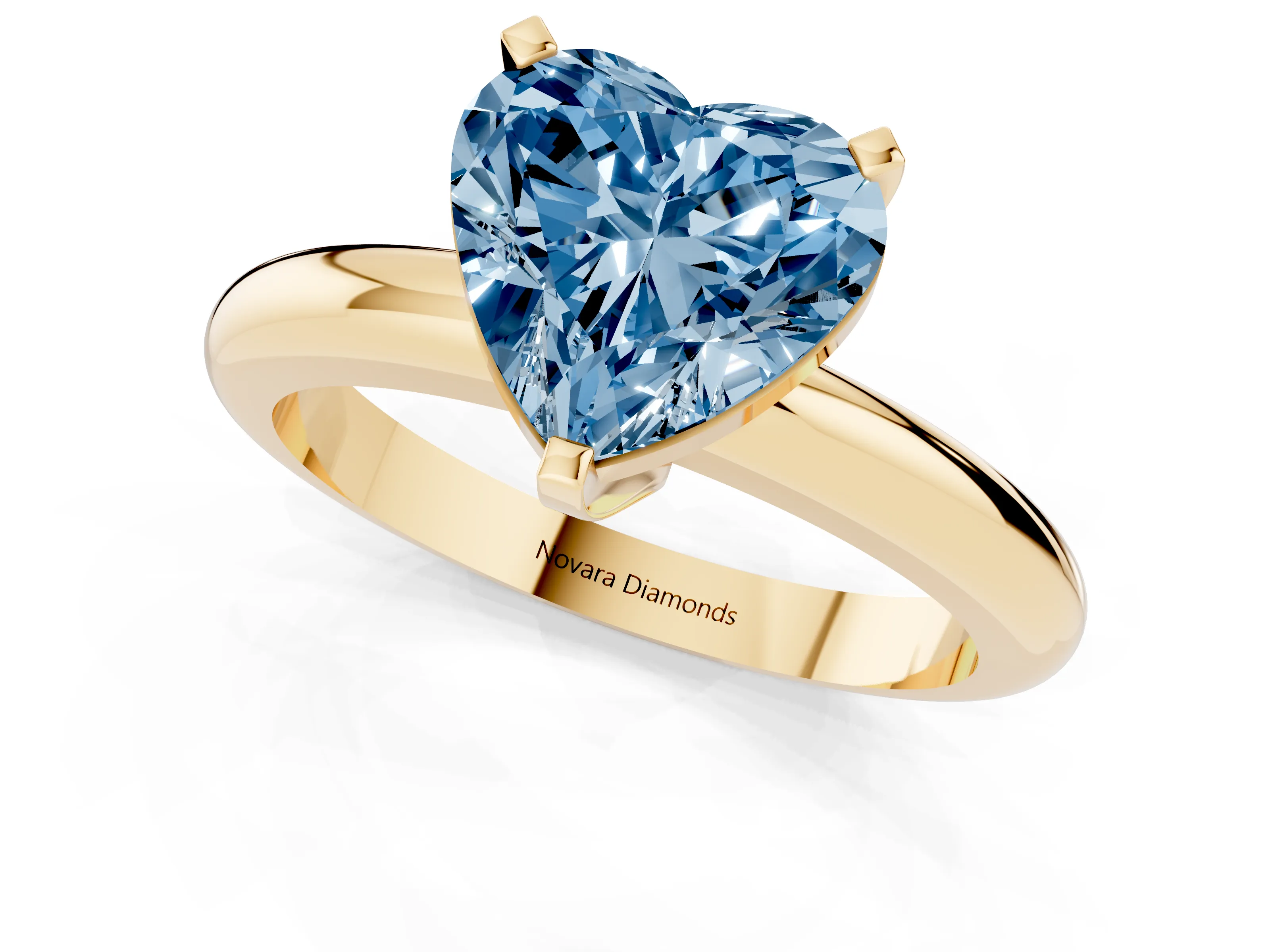 Fancy Blue Heart Cut Diamond Solitaire Engagement Ring Set in Yellow gold with Round Band and Prong Setting