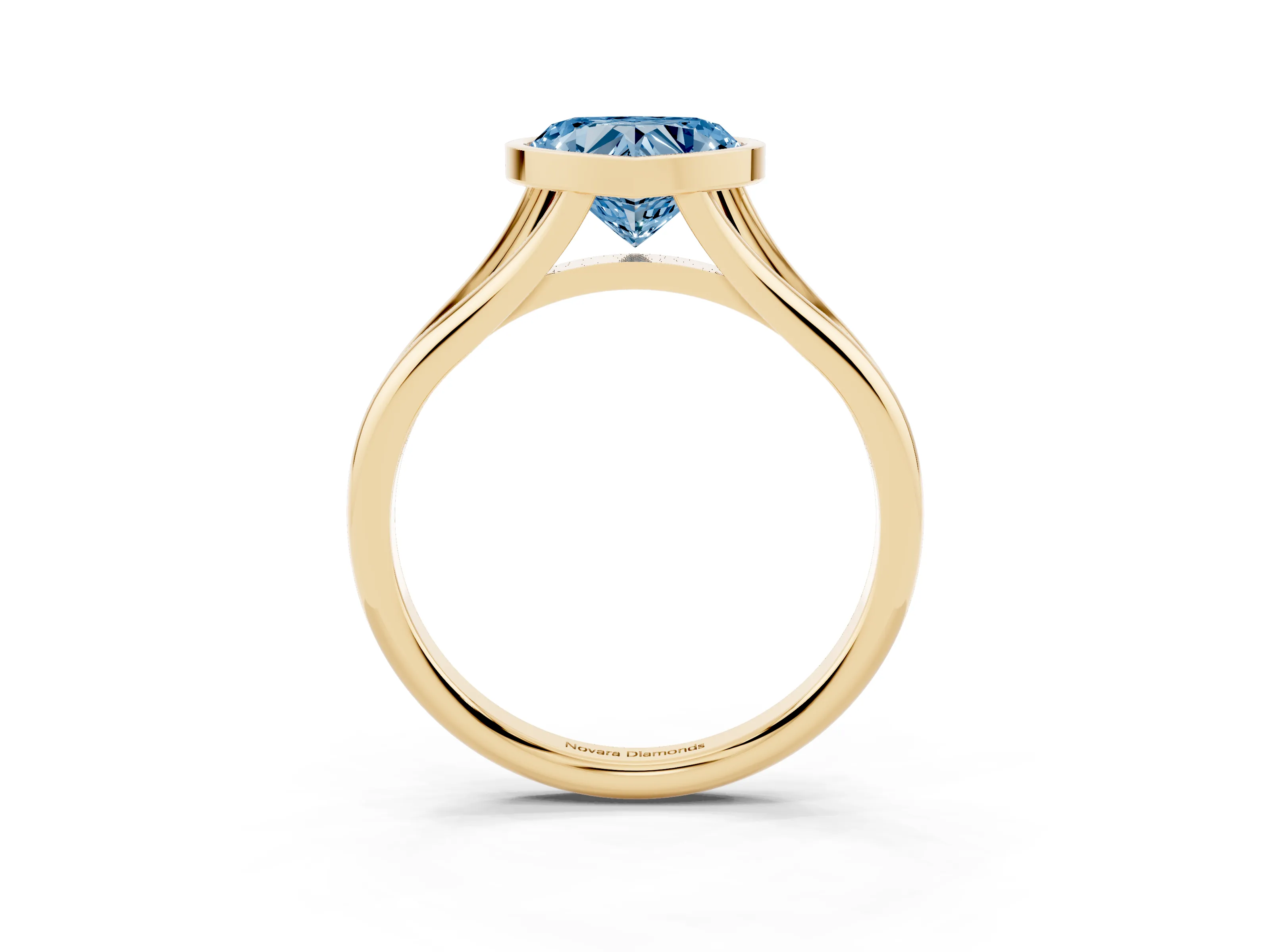 Fancy Blue Bezel Set Heart Cut Diamond Solitaire Ring Set in Yellow gold with Tapered Band