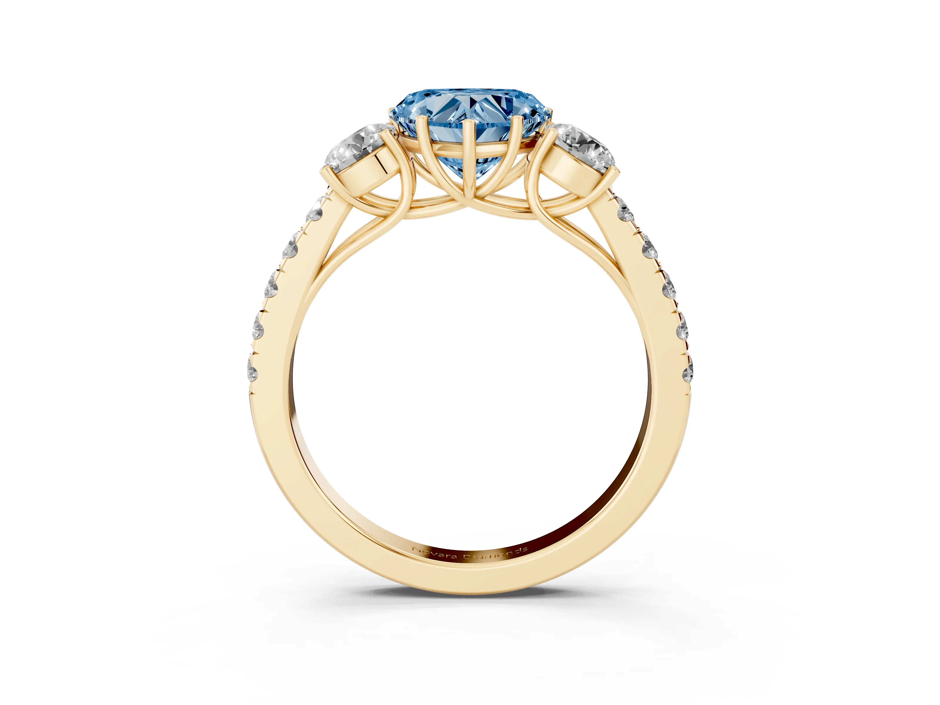 Fancy Blue Heart Cut Diamond Three-Stone Ring Set in Yellow gold with Round Side Stones and Delicate Pavé Band