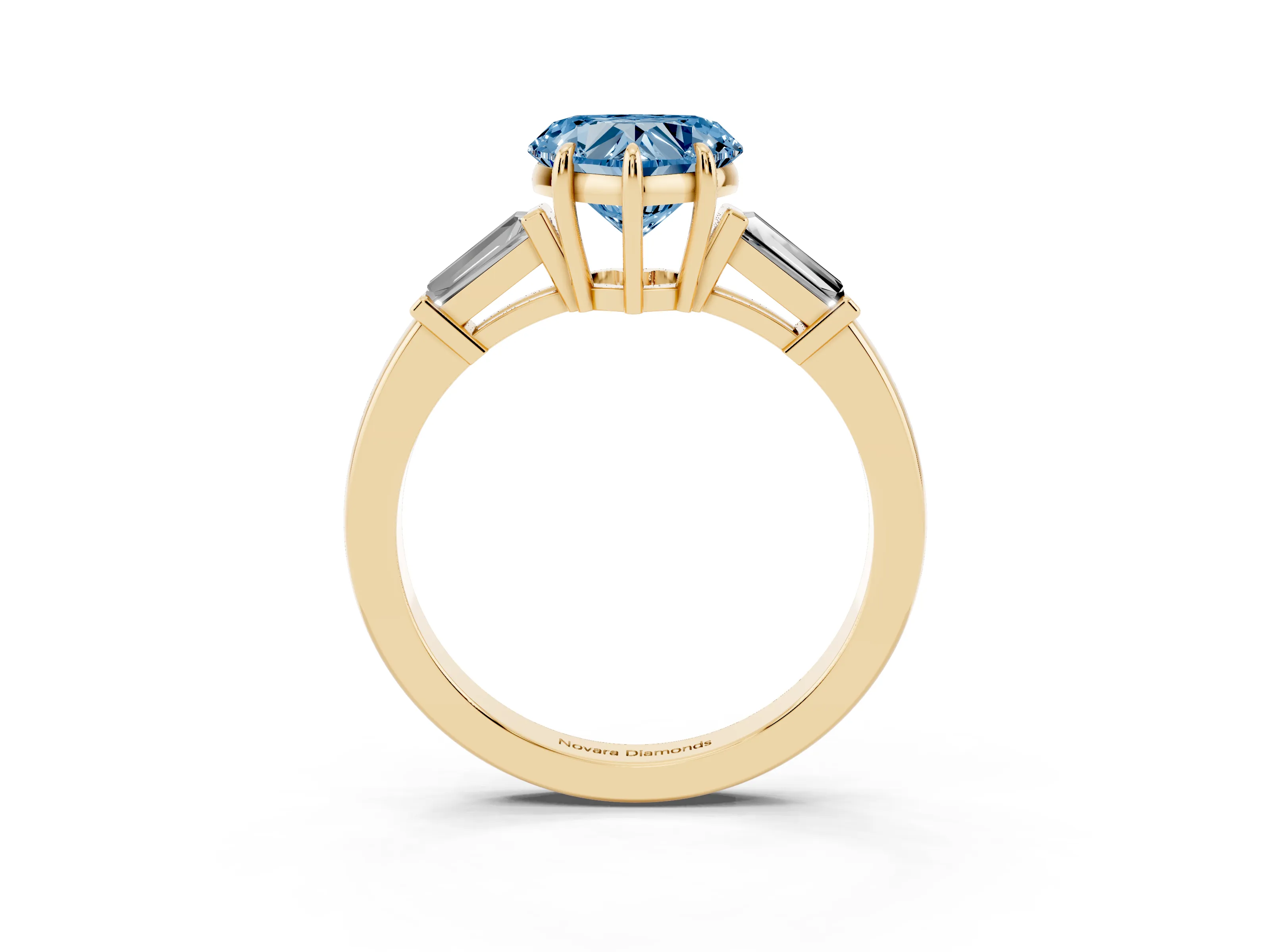 Fancy Blue Heart Cut Diamond Three-Stone Ring Set in Yellow gold with Tapered Baguette Side Stones and Prong Setting