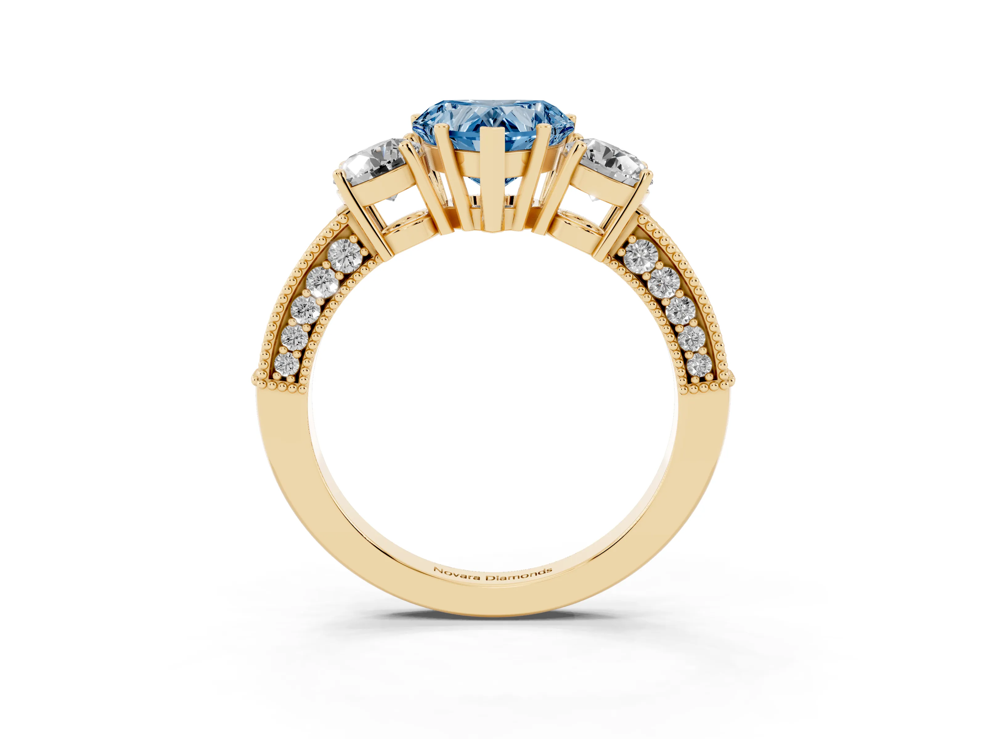 Fancy Blue Heart Cut Diamond Three-Stone Ring Set in Yellow gold with Round Side Stones and Pavé Band