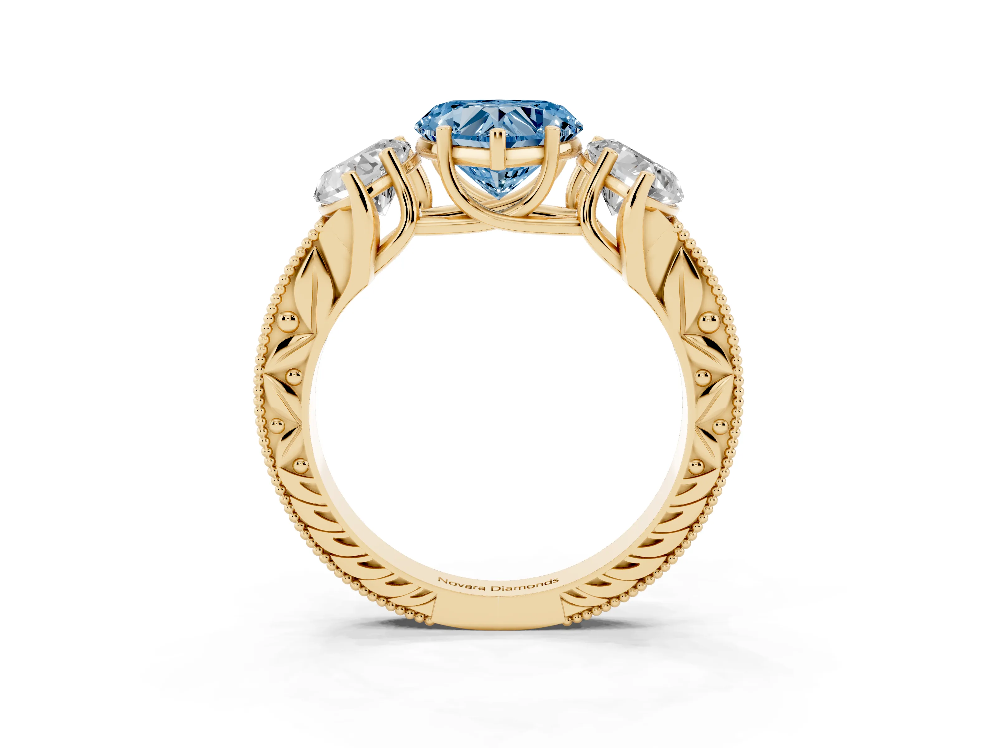 Fancy Blue Heart Cut Diamond Three-Stone Engagement Ring Set in Yellow gold with Milgrain Pavé Band