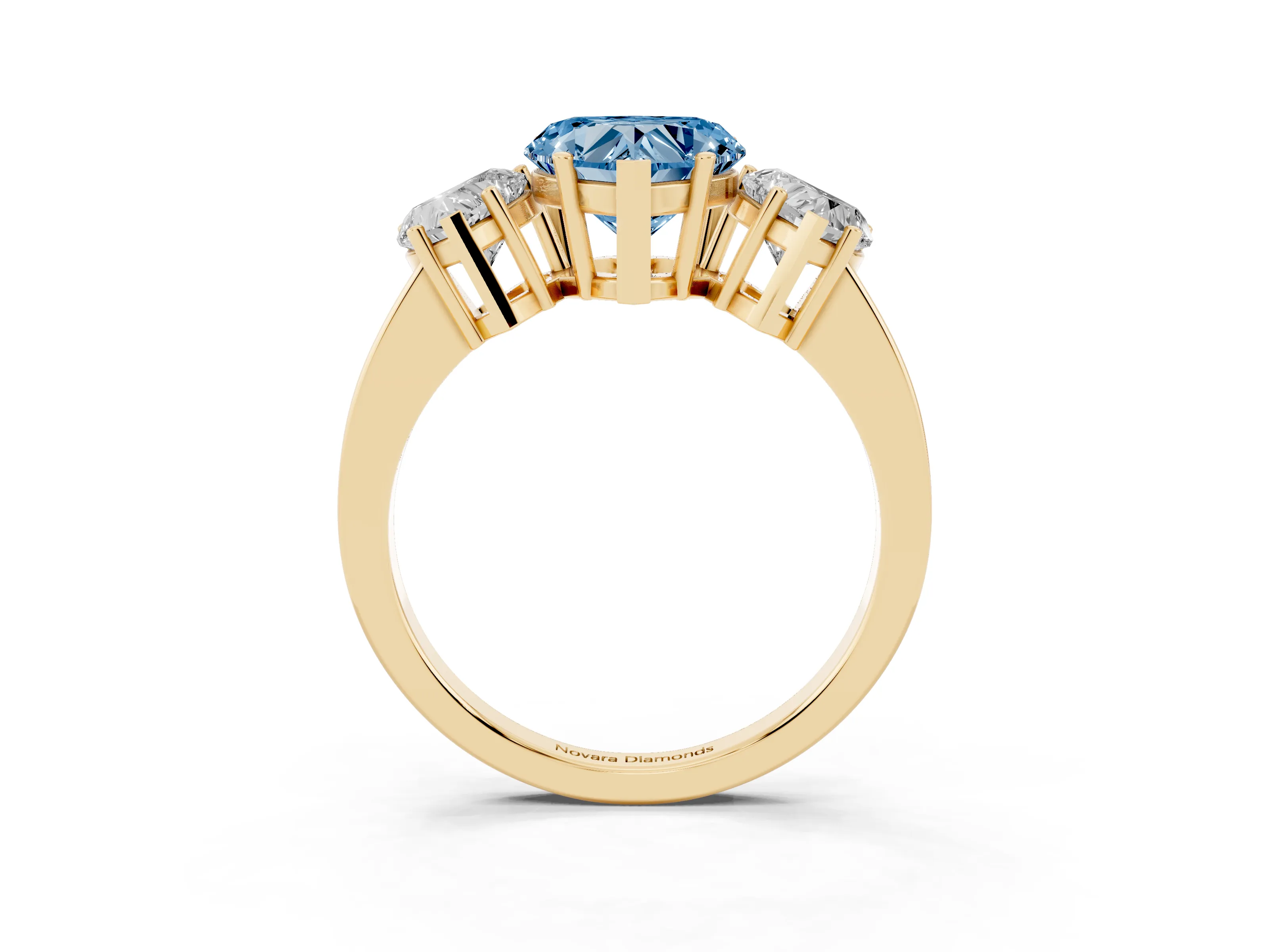 Fancy Blue Heart Cut Diamond Three-Stone Engagement Ring Set in Yellow gold with Flat Band