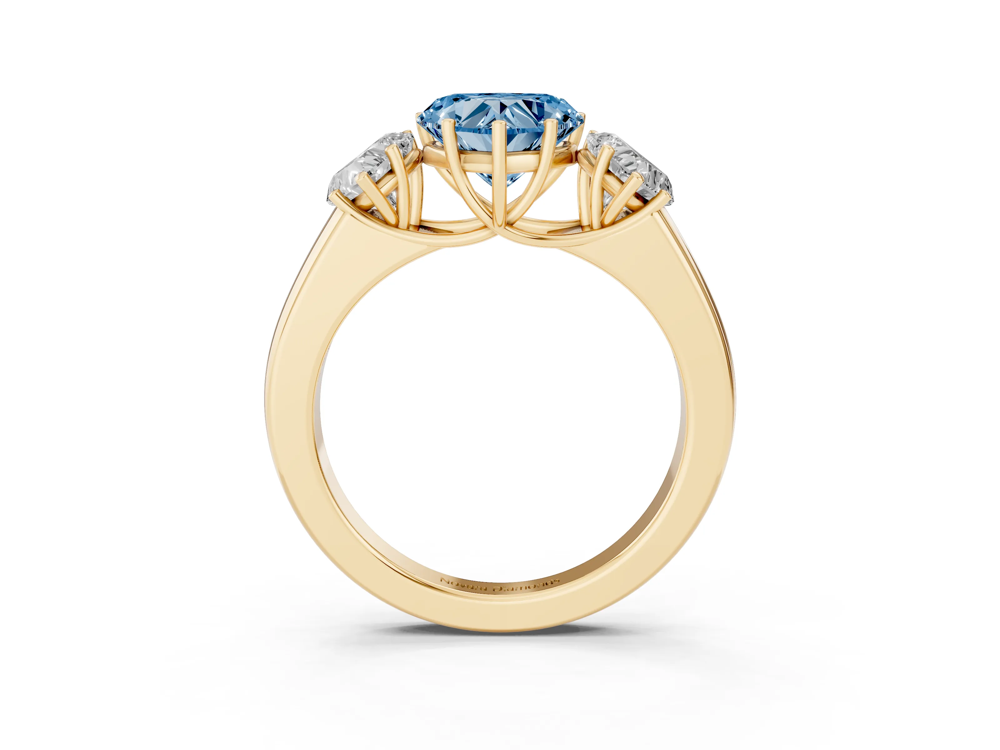 Fancy Blue Three-Stone Heart Cut Diamond Ring Set in Yellow gold with Matching Prong Settings and Plain Band