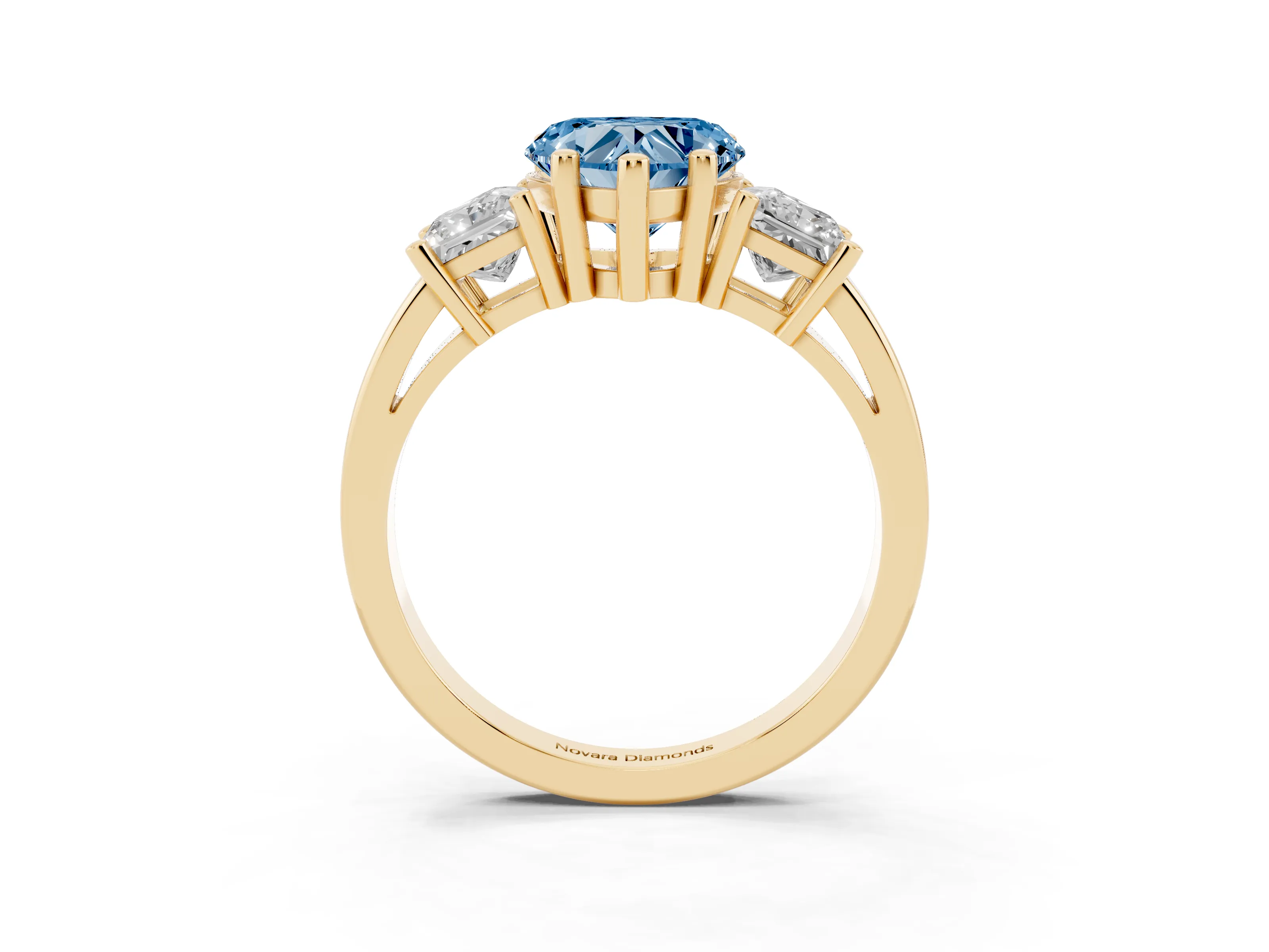 Fancy Blue Three-Stone Heart Cut Diamond Solitaire Ring Set in Yellow gold with Prong Setting
