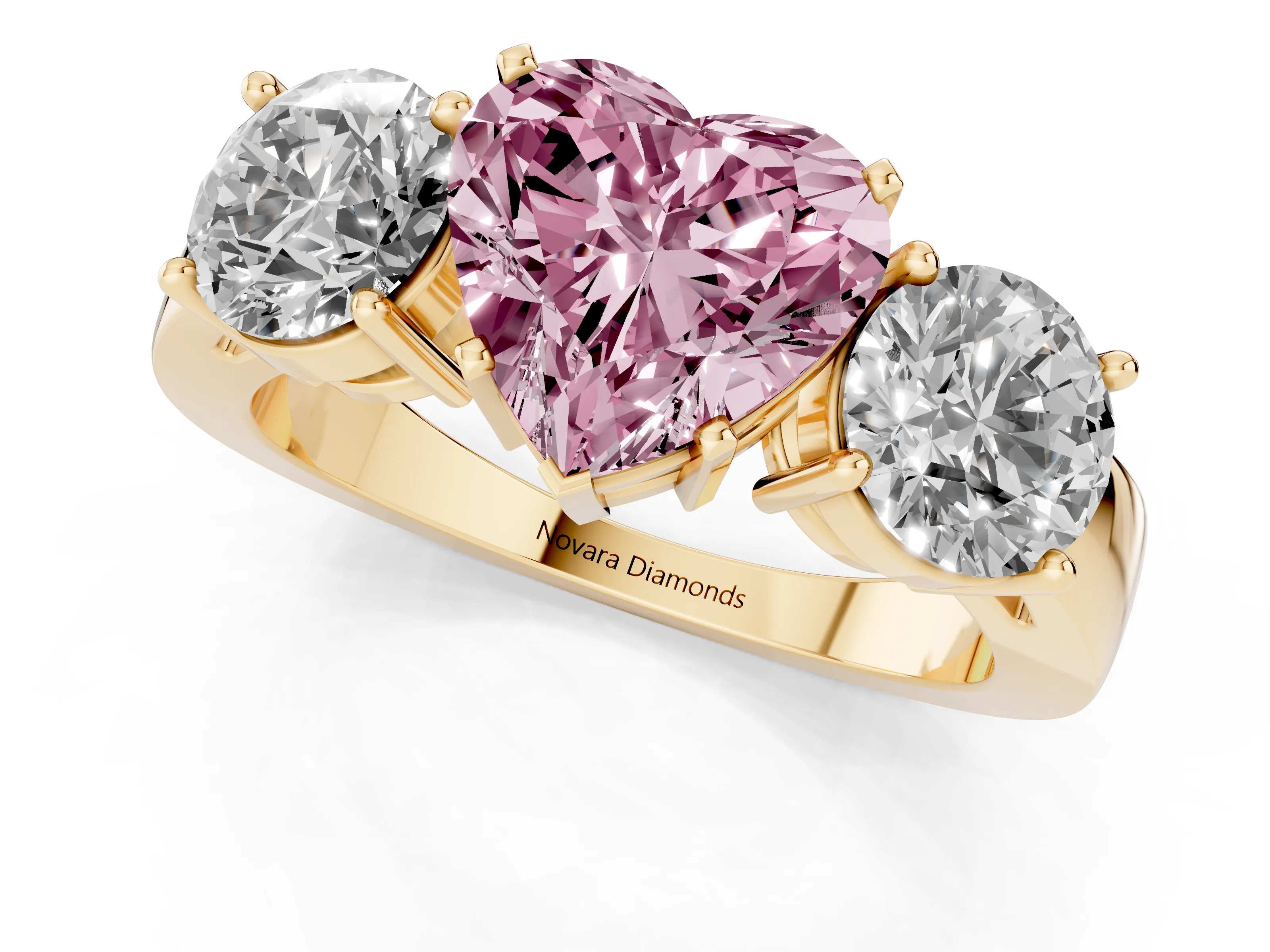 Fancy Pink Heart Cut Diamond Three-Stone Ring Set in Yellow gold with Round Side Stones and Classic Band