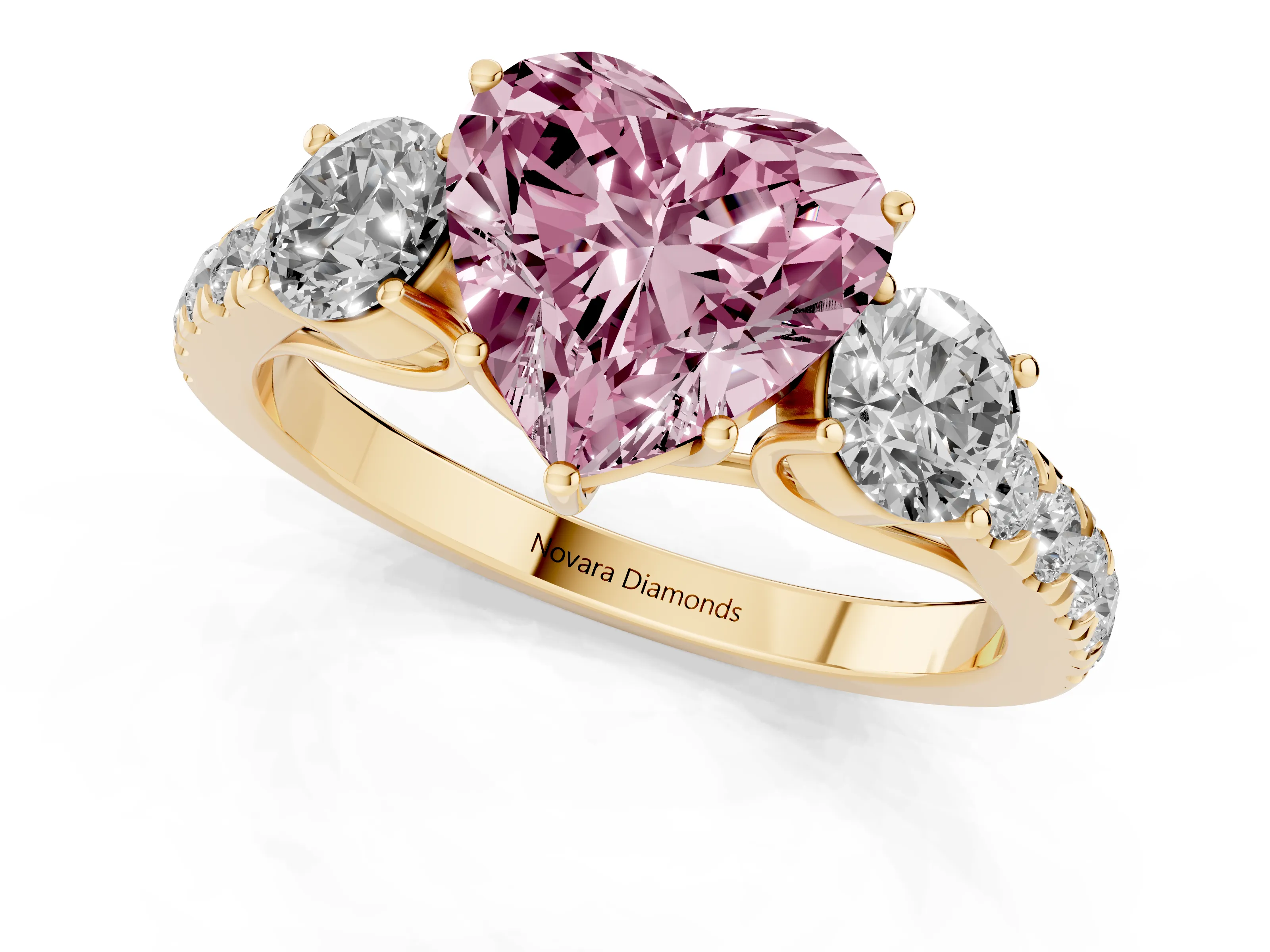 Fancy Pink Heart Cut Diamond Three-Stone Ring Set in Yellow gold with Round Side Stones and Delicate Pavé Band
