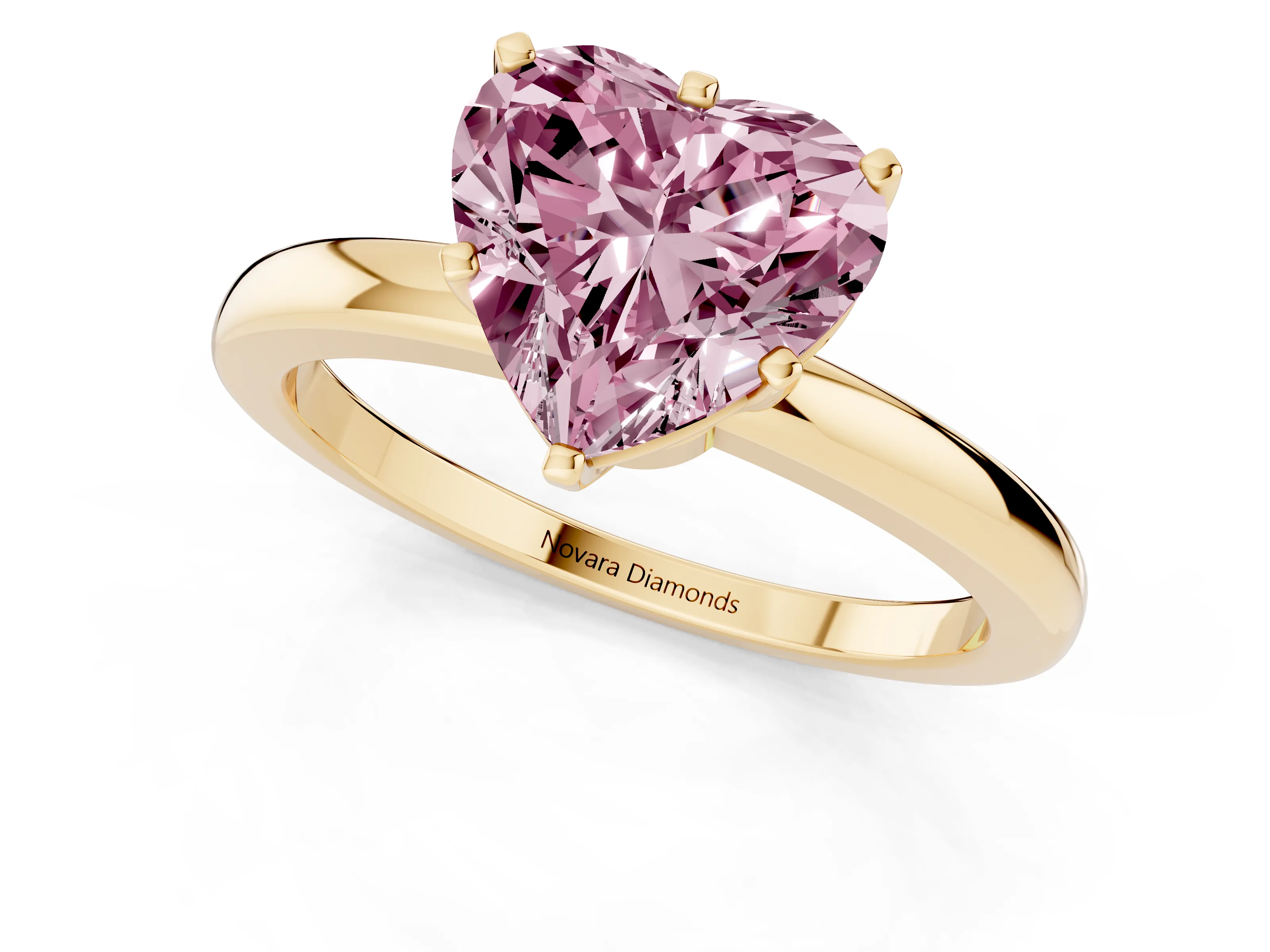 Fancy Pink Heart Cut Diamond Solitaire Ring Set in Yellow gold with Raised Prong Setting on a Classic Band