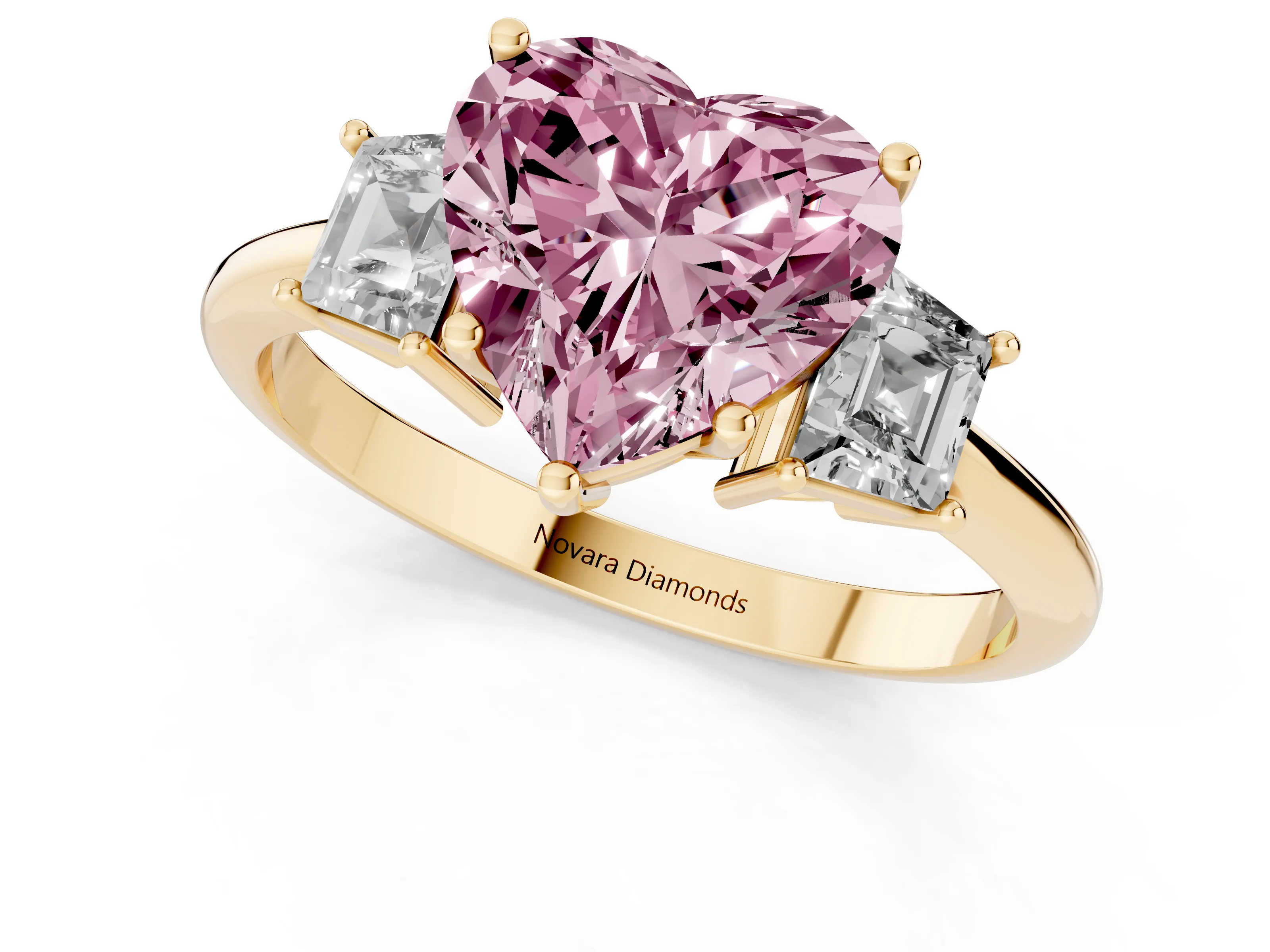 Fancy Pink Heart Cut Diamond Three-Stone Ring Set in Yellow gold with Trapezoid Side Stones and Prong Setting