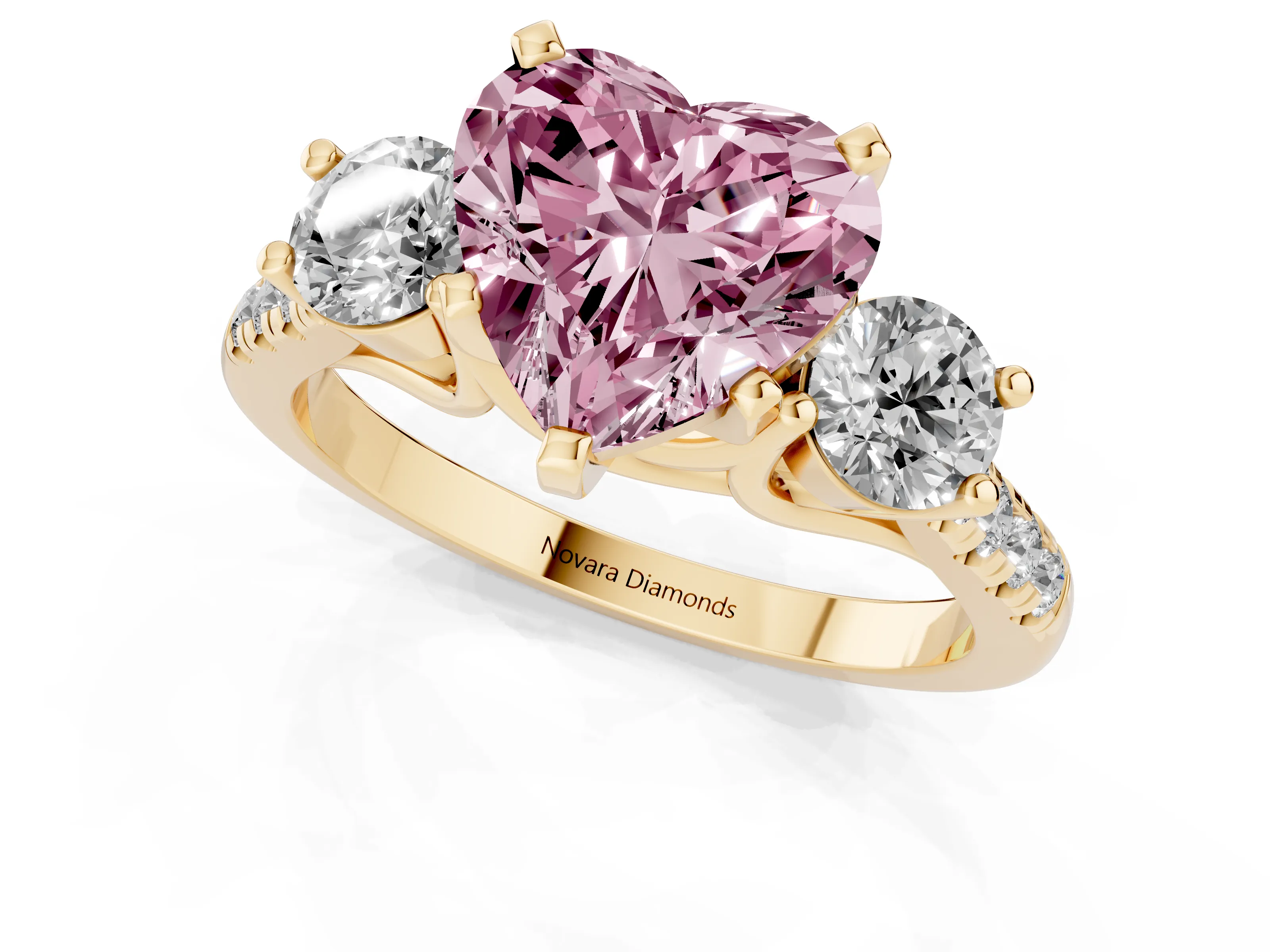 Fancy Pink Three-Stone Heart Cut Diamond Pavé Band Ring Set in Yellow gold with Prong-Set Trio