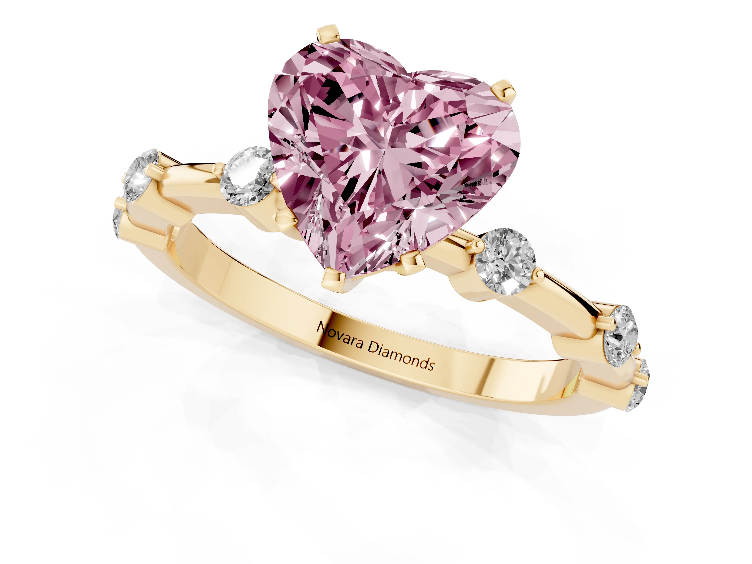 Fancy Pink Heart Cut Diamond Solitaire Ring Set in Yellow gold with Bezel Set Side Stones and Prong Setting