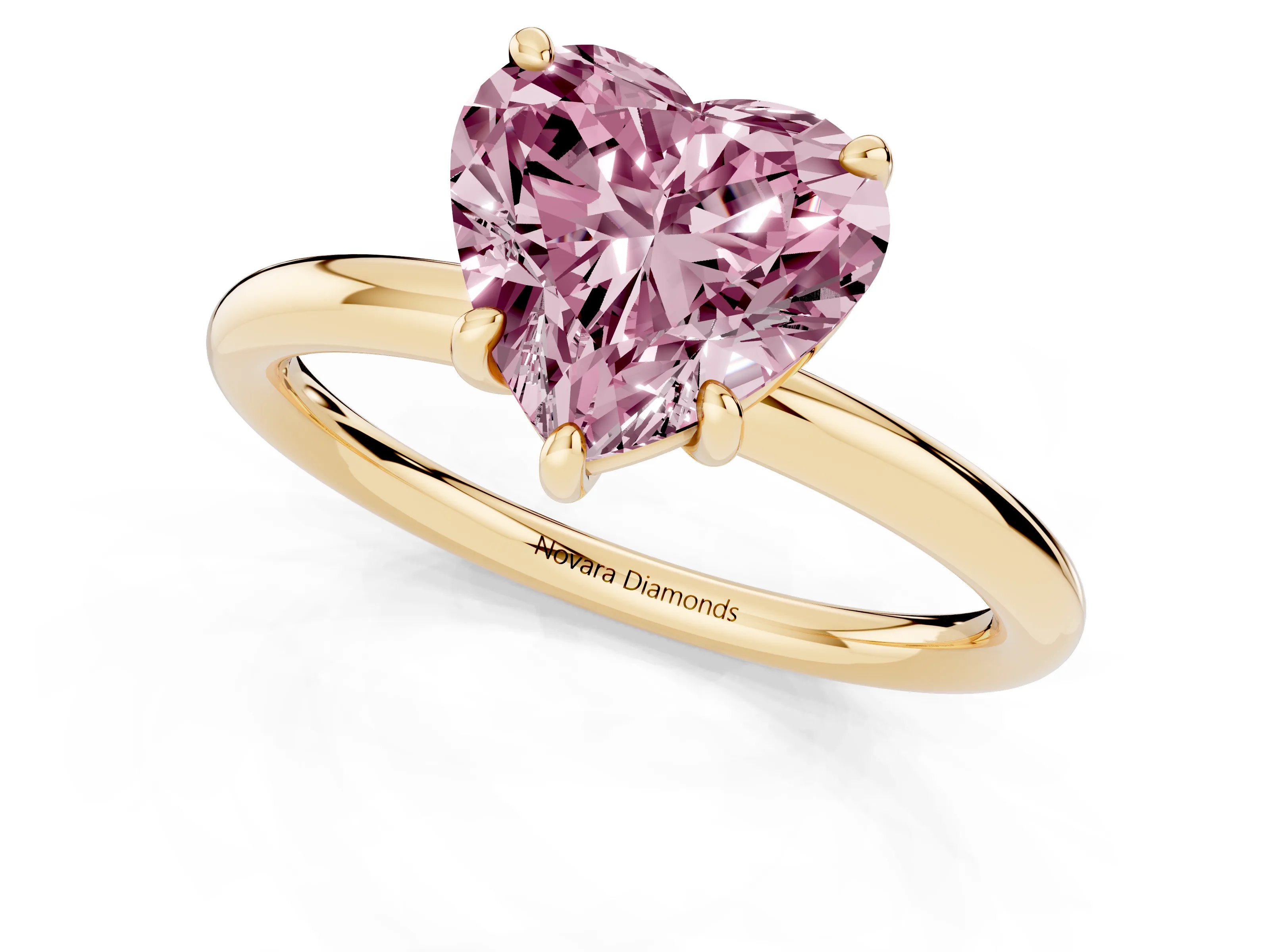 Fancy Pink Heart Cut Diamond Solitaire Ring Set in Yellow gold with Prong Setting on a Polished Plain Band