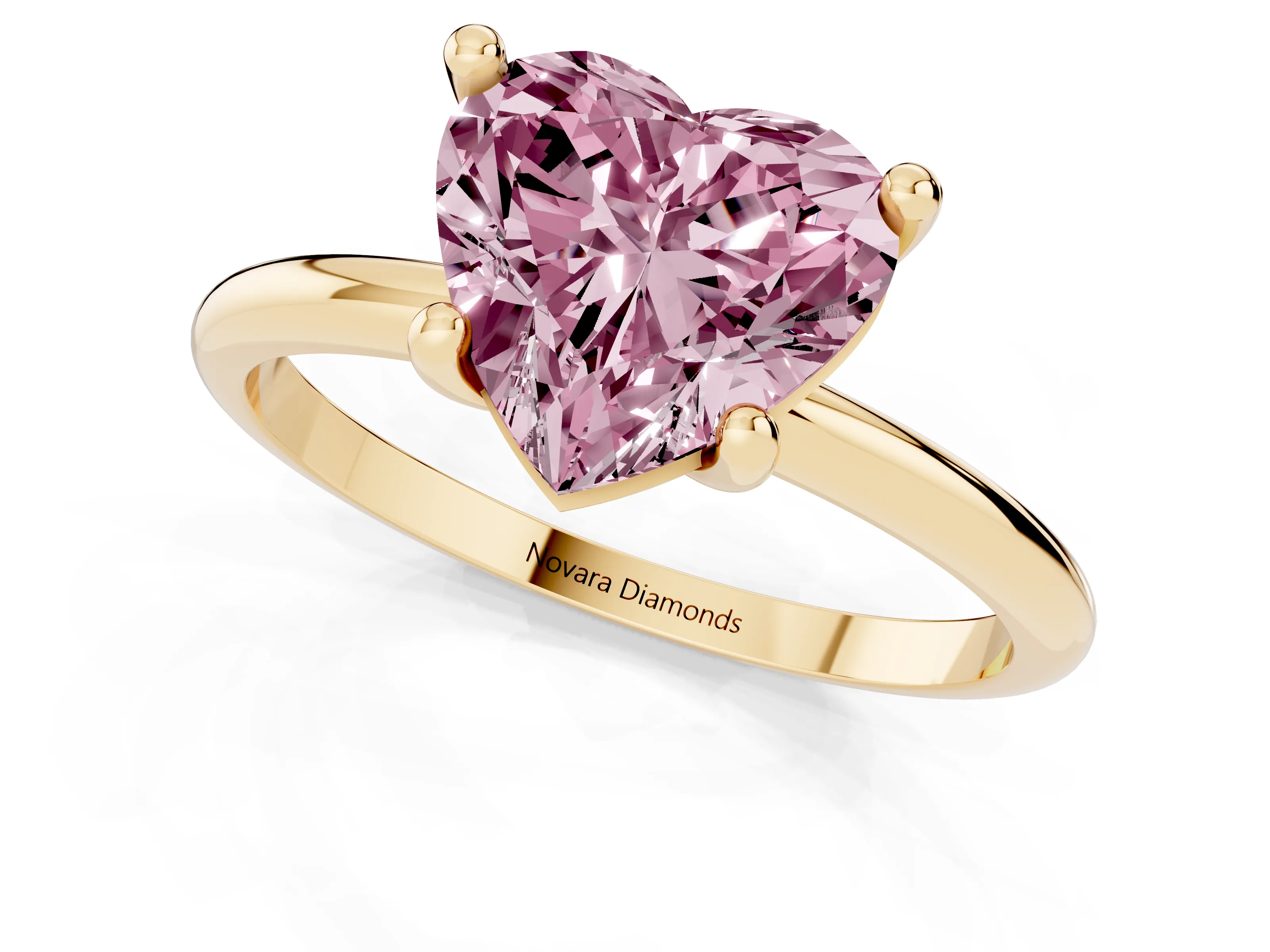 Fancy Pink Heart Cut Diamond Solitaire Ring Set in Yellow gold with Secure Prong Setting on a Classic Band
