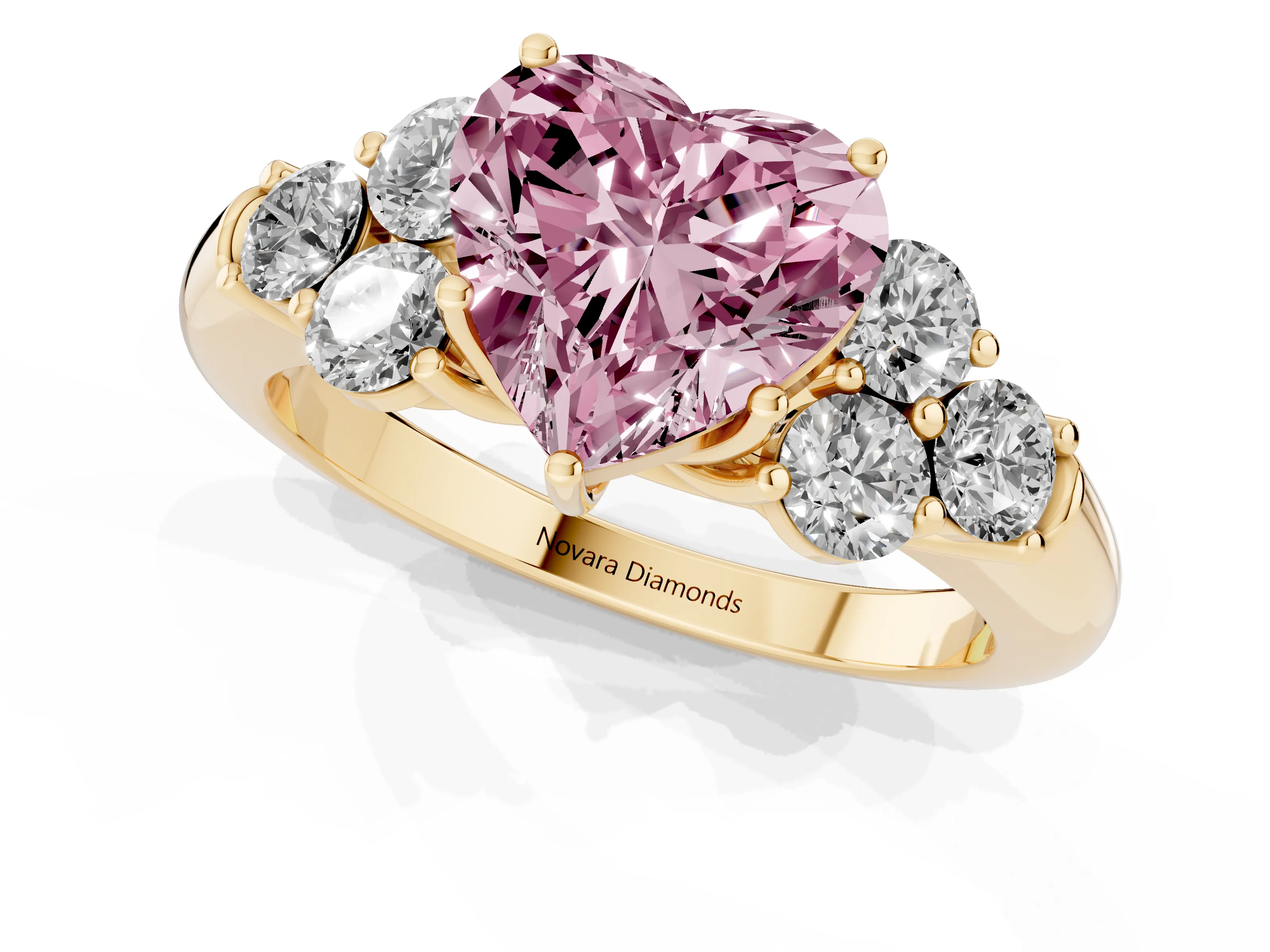 Fancy Pink Heart Cut Diamond Cluster Ring Set in Yellow gold with Round Accent Stones and Prong Setting on a Plain Band
