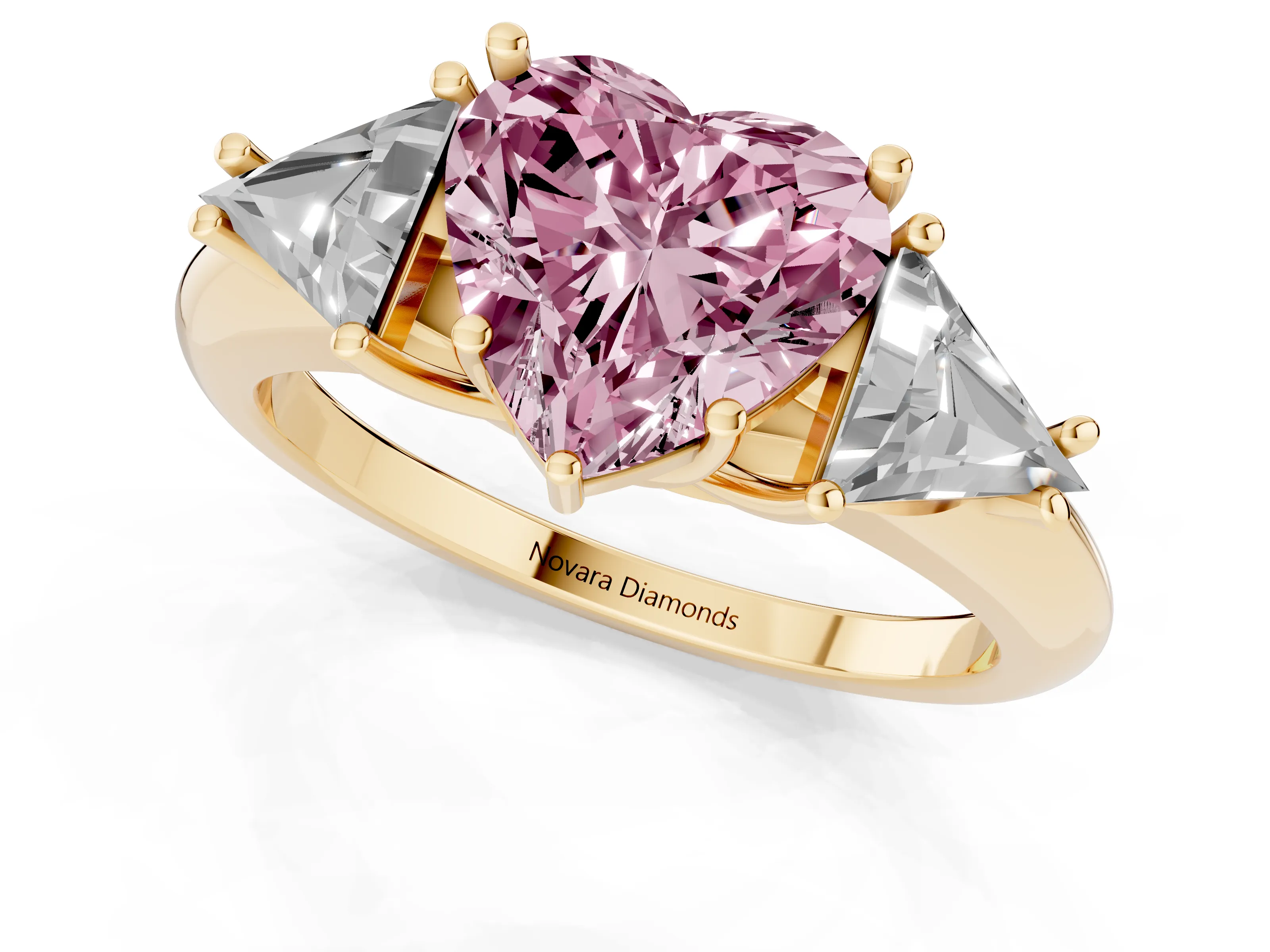 Fancy Pink Heart Cut Diamond Three-Stone Engagement Ring Set in Yellow gold with Trillion Side Stones