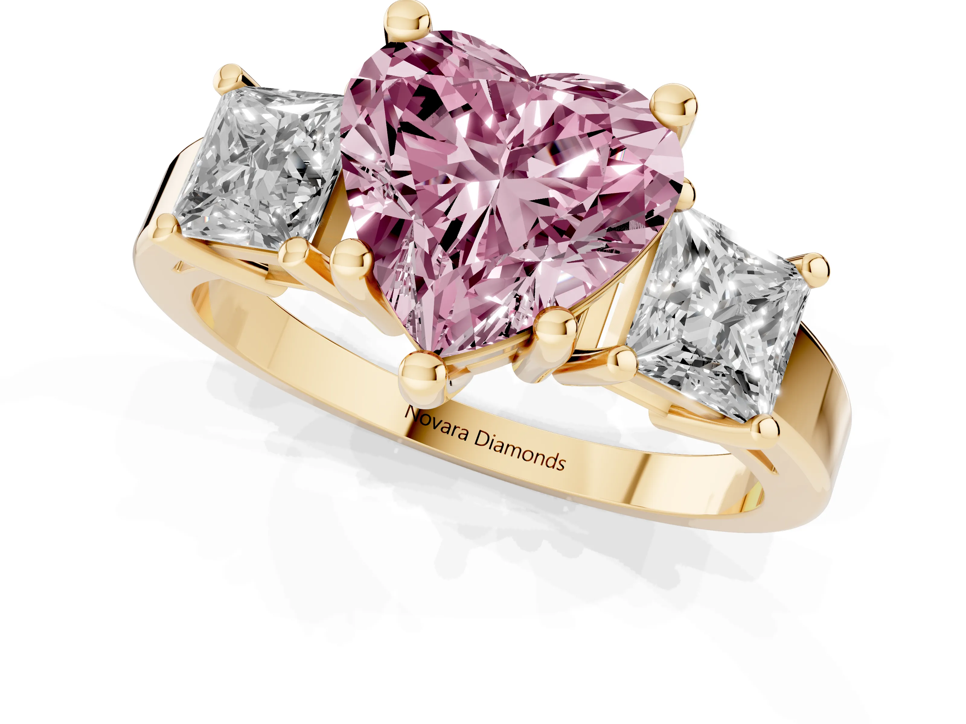 Fancy Pink Three-Stone Heart Cut Diamond Solitaire Ring Set in Yellow gold with Prong Setting