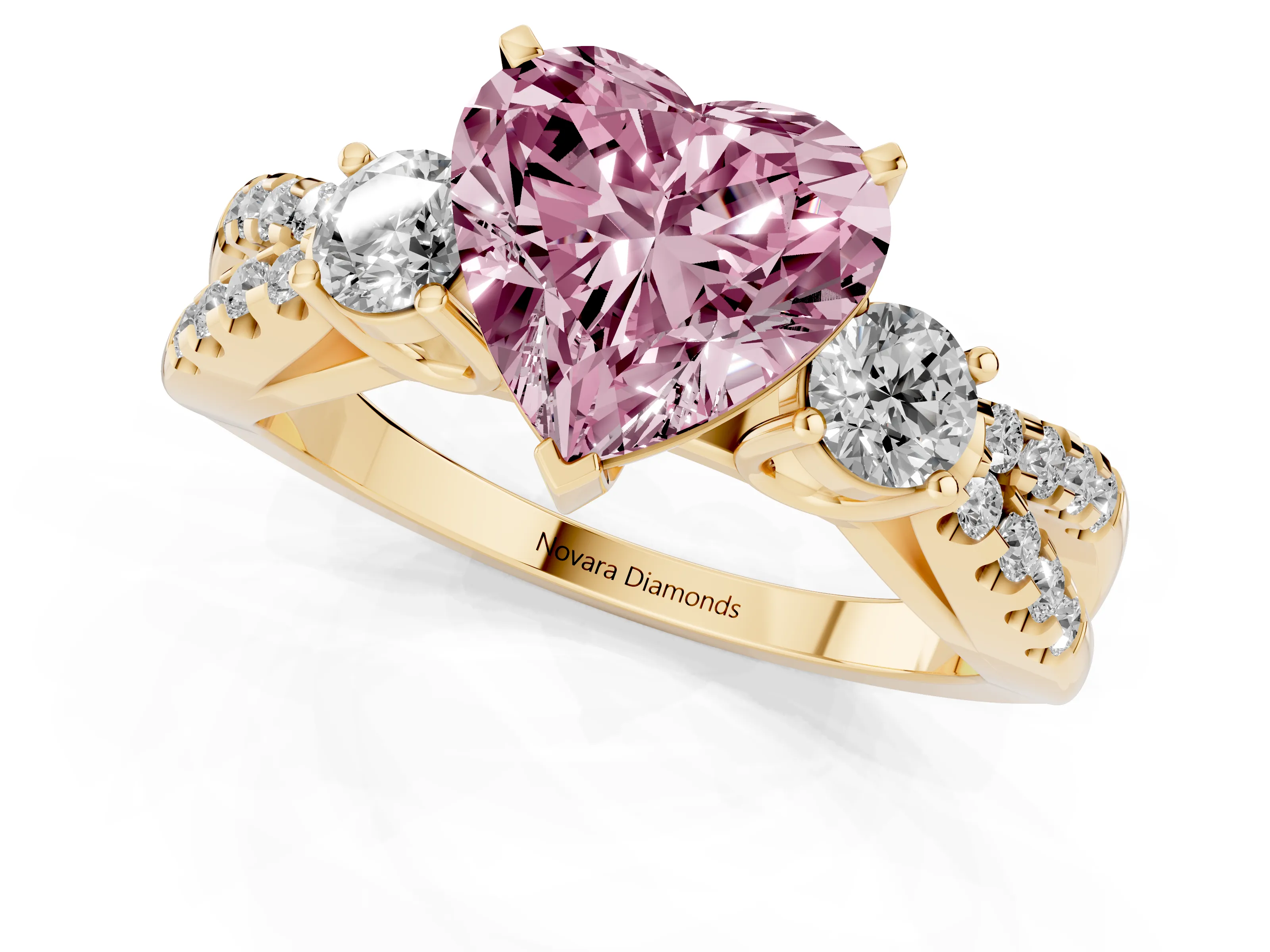 Fancy Pink Heart Cut Diamond Three-Stone Ring Set in Yellow gold with Pavé Split Shank and Prong Setting