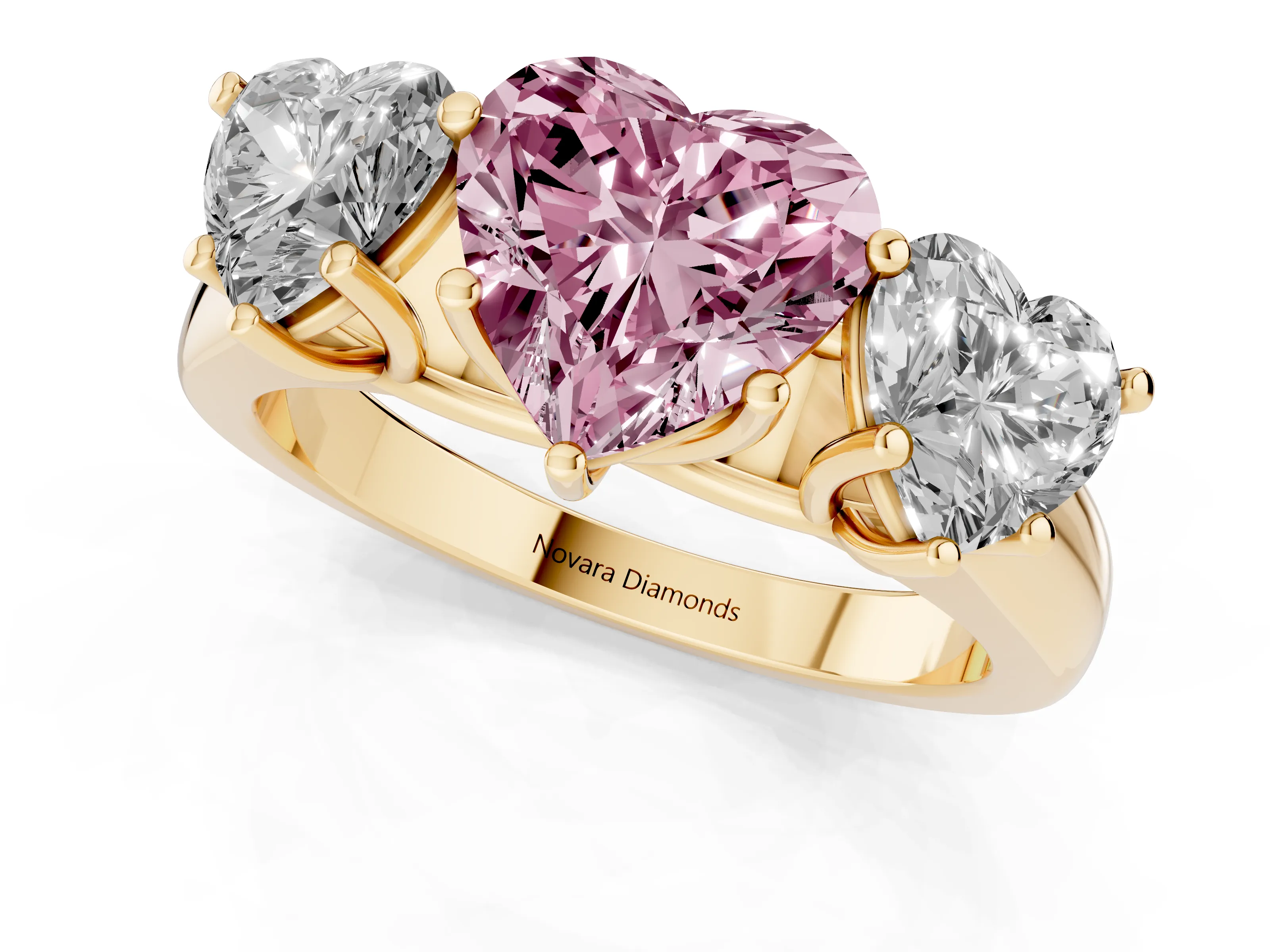 Fancy Pink Heart Cut Diamond Three-Stone Ring Set in Yellow gold with Plain Polished Band