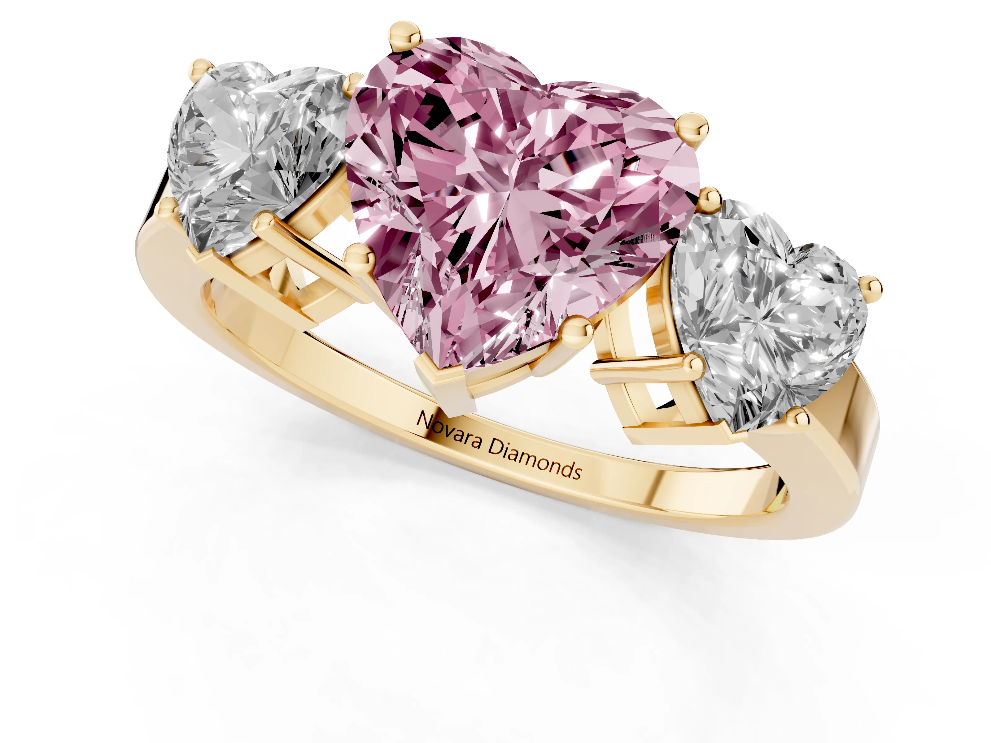 Fancy Pink Heart Cut Diamond Three-Stone Engagement Ring Set in Yellow gold with Flat Band