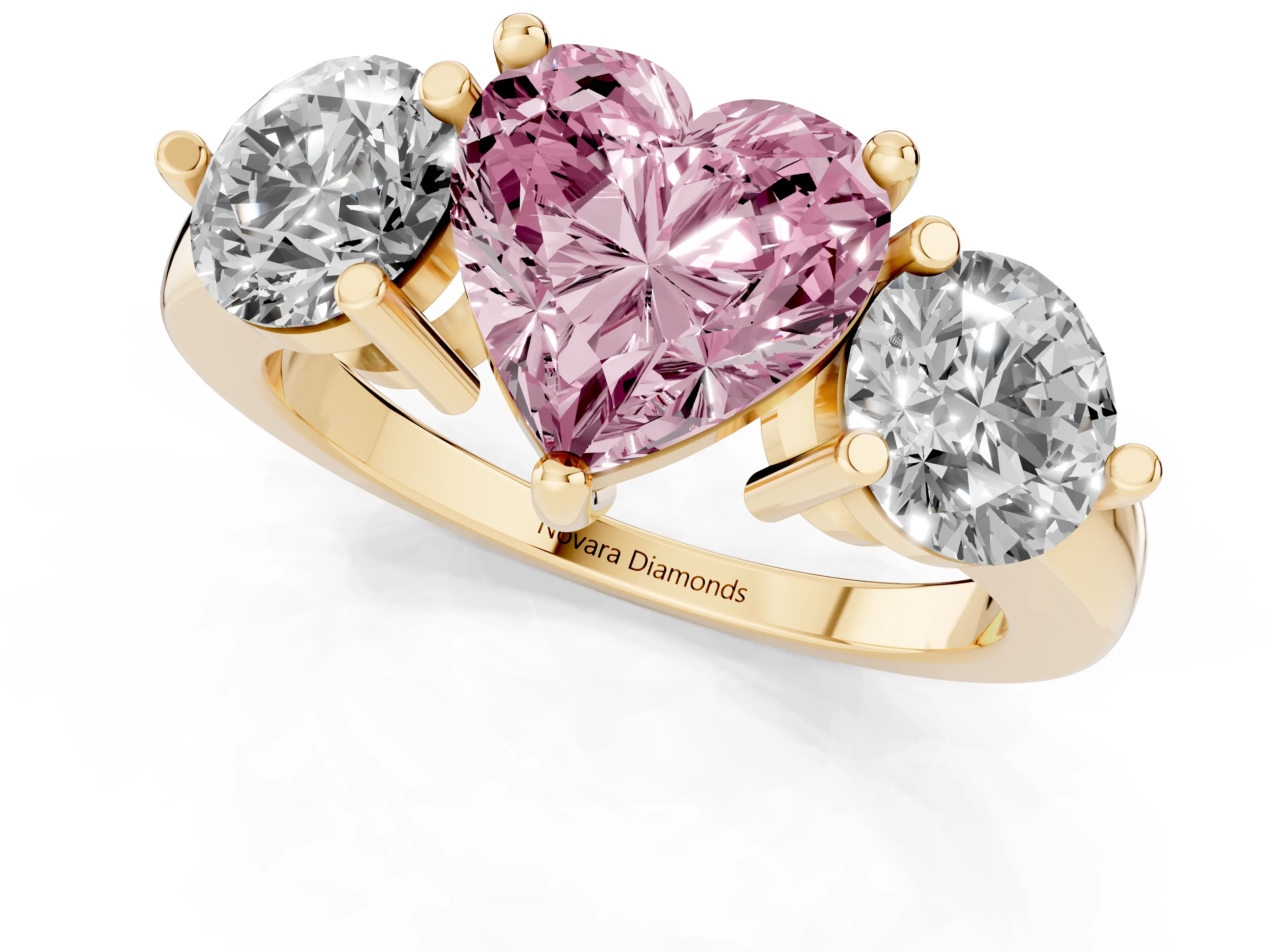 Fancy Pink Heart Cut Diamond Three-Stone Ring Set in Yellow gold with Prong Setting and Classic Band