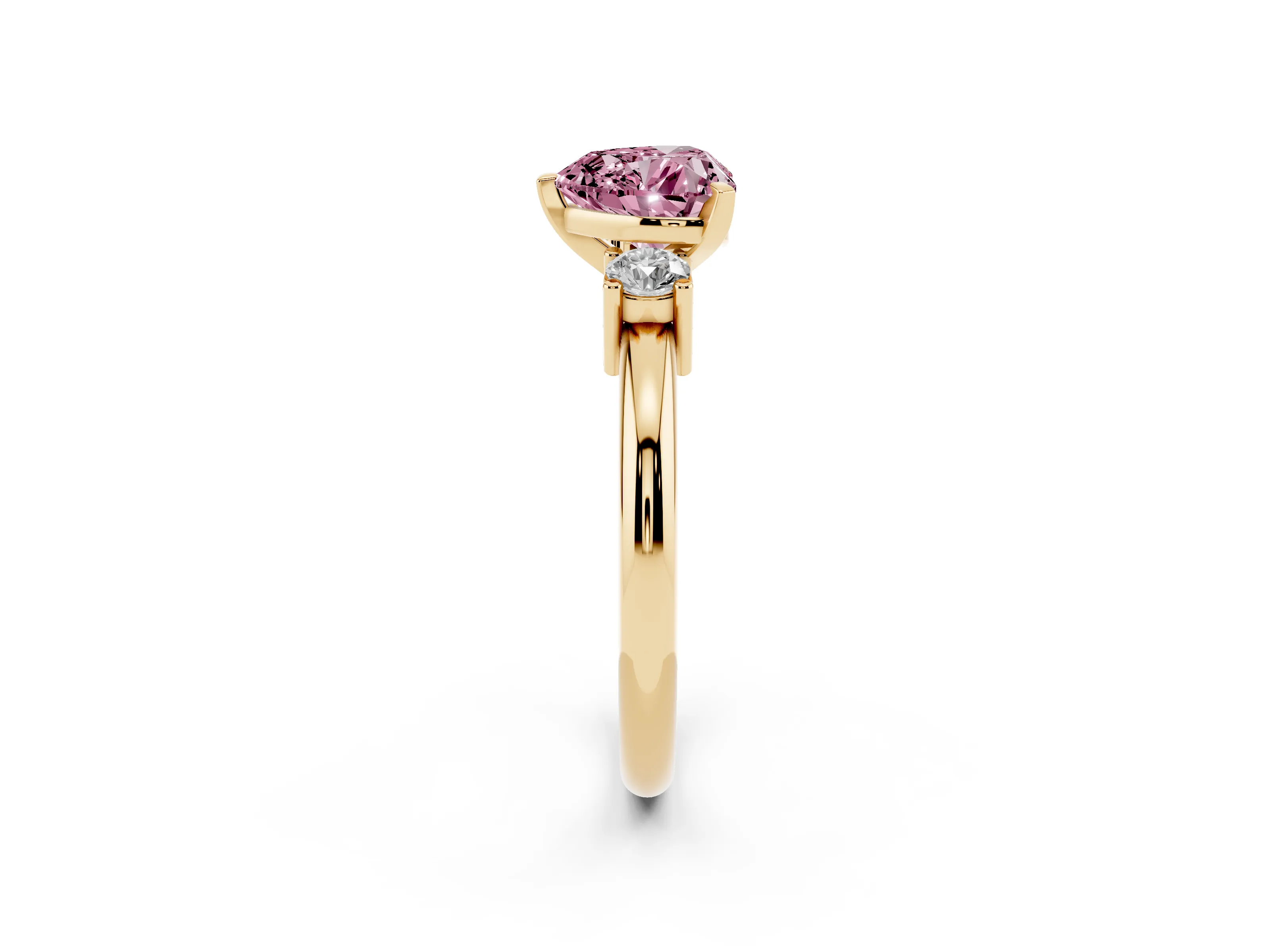 Fancy Pink Three-Stone Heart Cut Diamond Ring Set in Yellow gold with Prong Setting and Plain Band