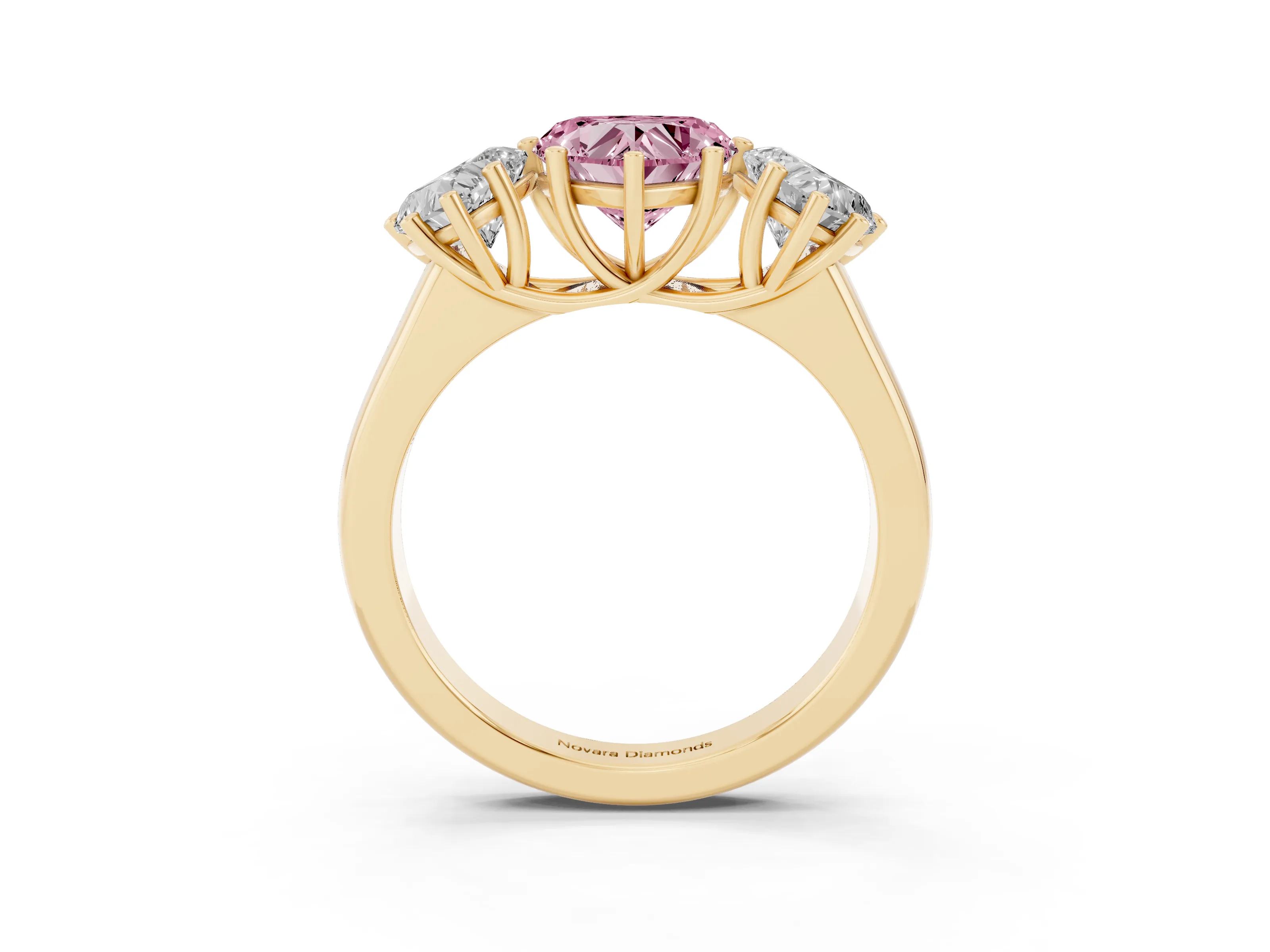 Fancy Pink Heart Cut Diamond Three-Stone Ring Set in Yellow gold with Plain Polished Band