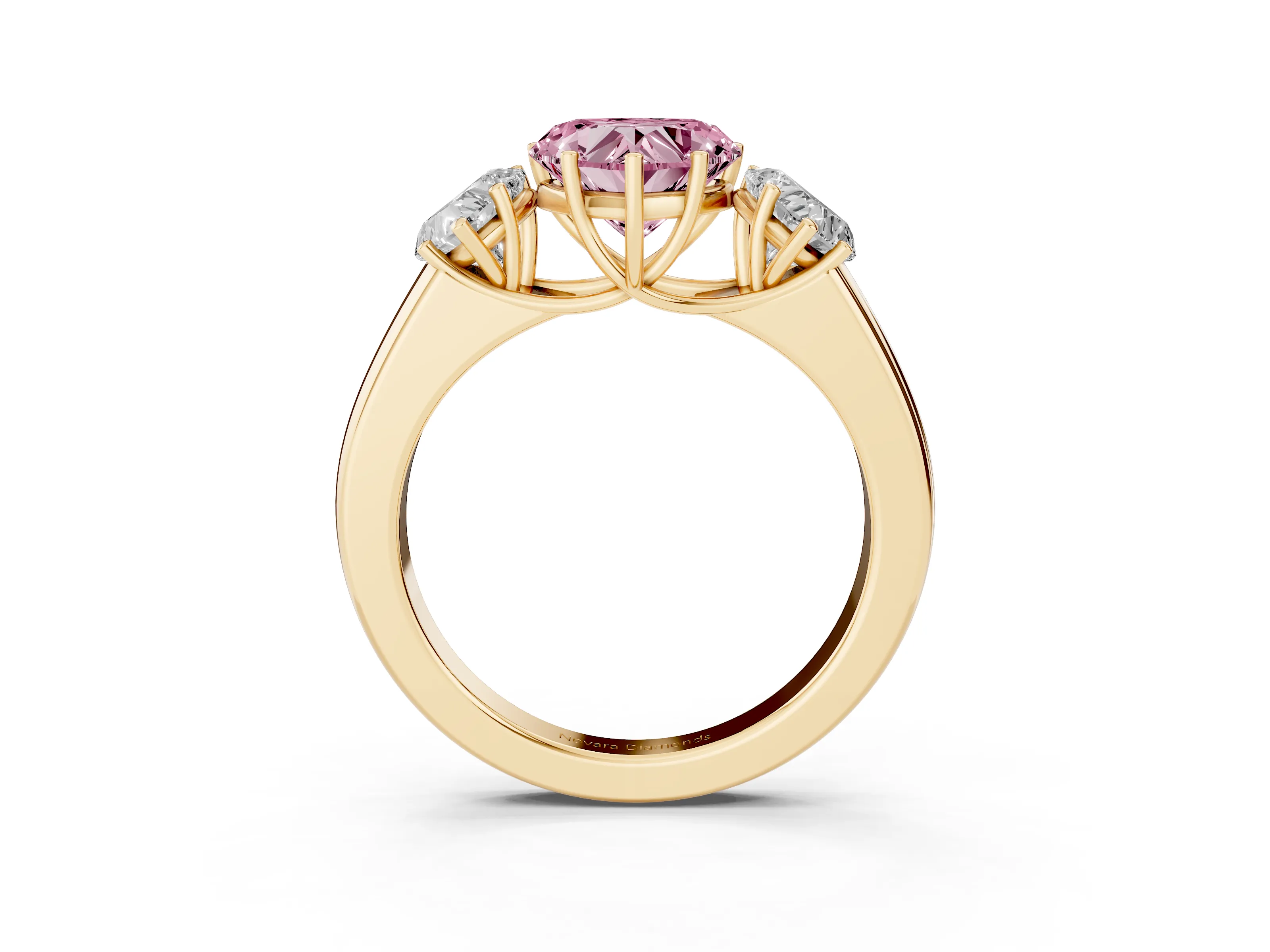Fancy Pink Three-Stone Heart Cut Diamond Ring Set in Yellow gold with Matching Prong Settings and Plain Band