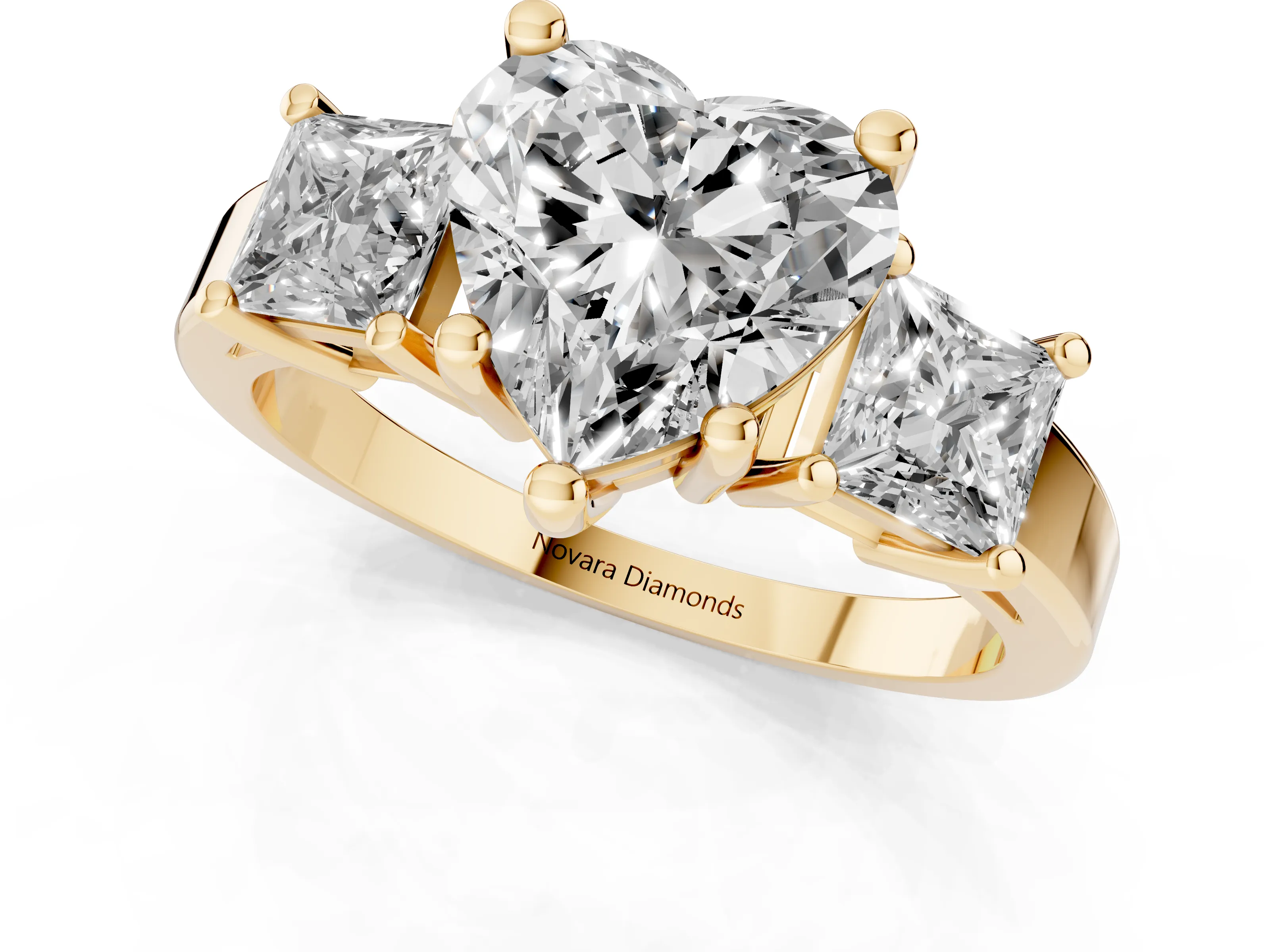 Three-Stone Heart Cut Diamond Solitaire Ring Set in Yellow gold with Prong Setting