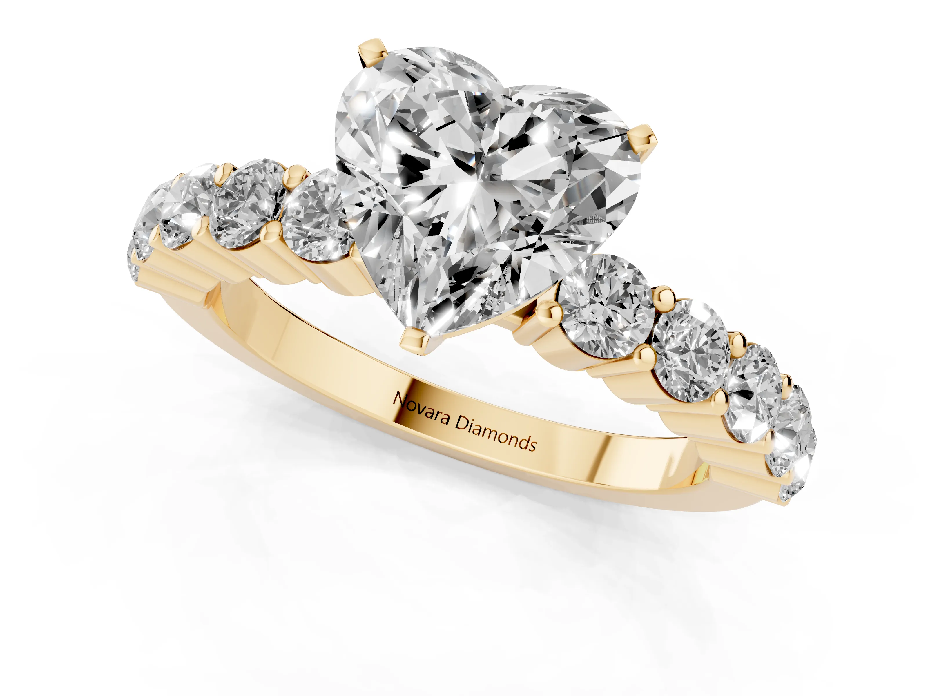 Heart Cut Diamond Solitaire Ring Set in Yellow gold with Shared Prong Round Side Stones