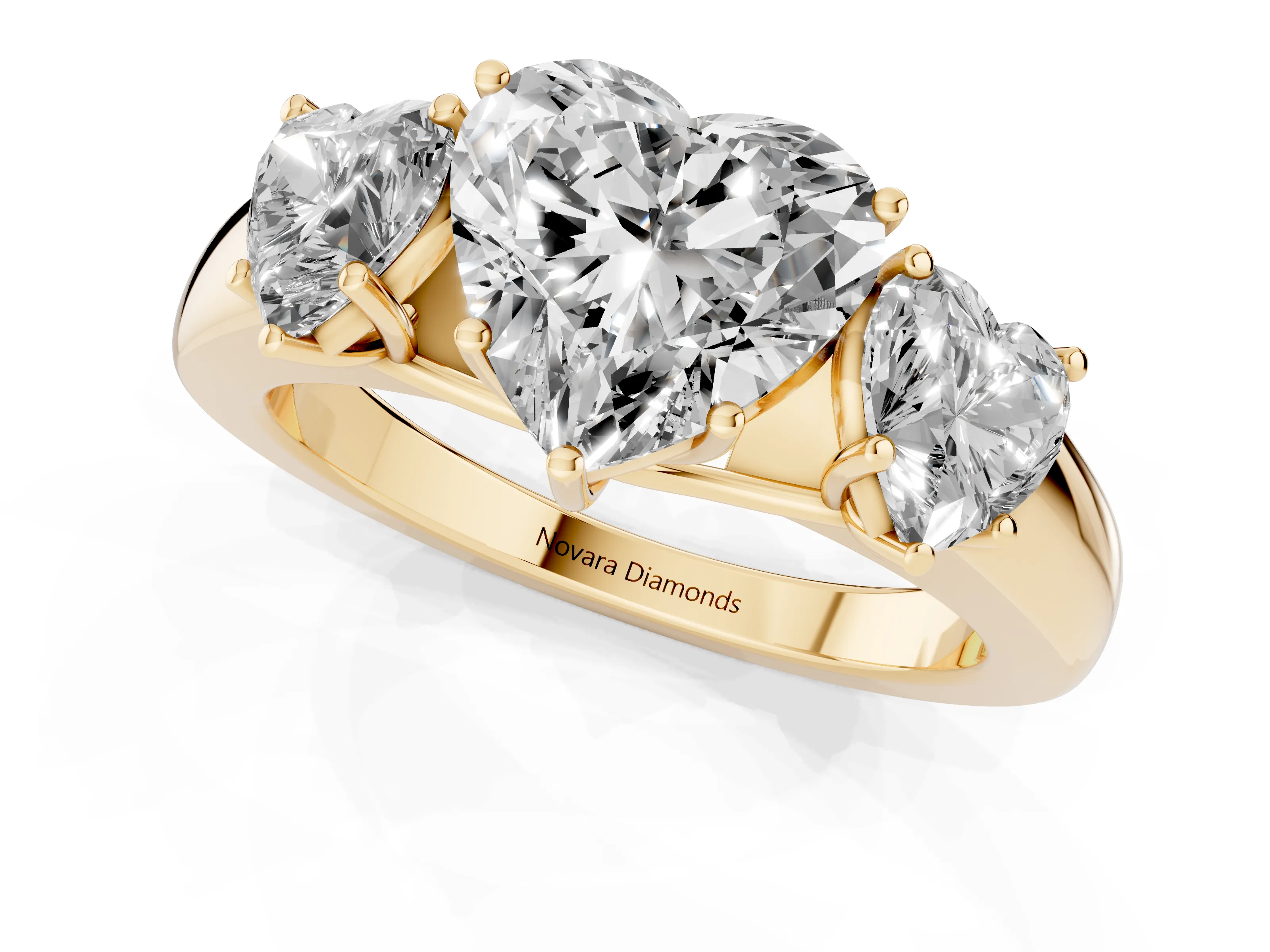 Three-Stone Heart Cut Diamond Ring Set in Yellow gold with Matching Prong Settings and Plain Band