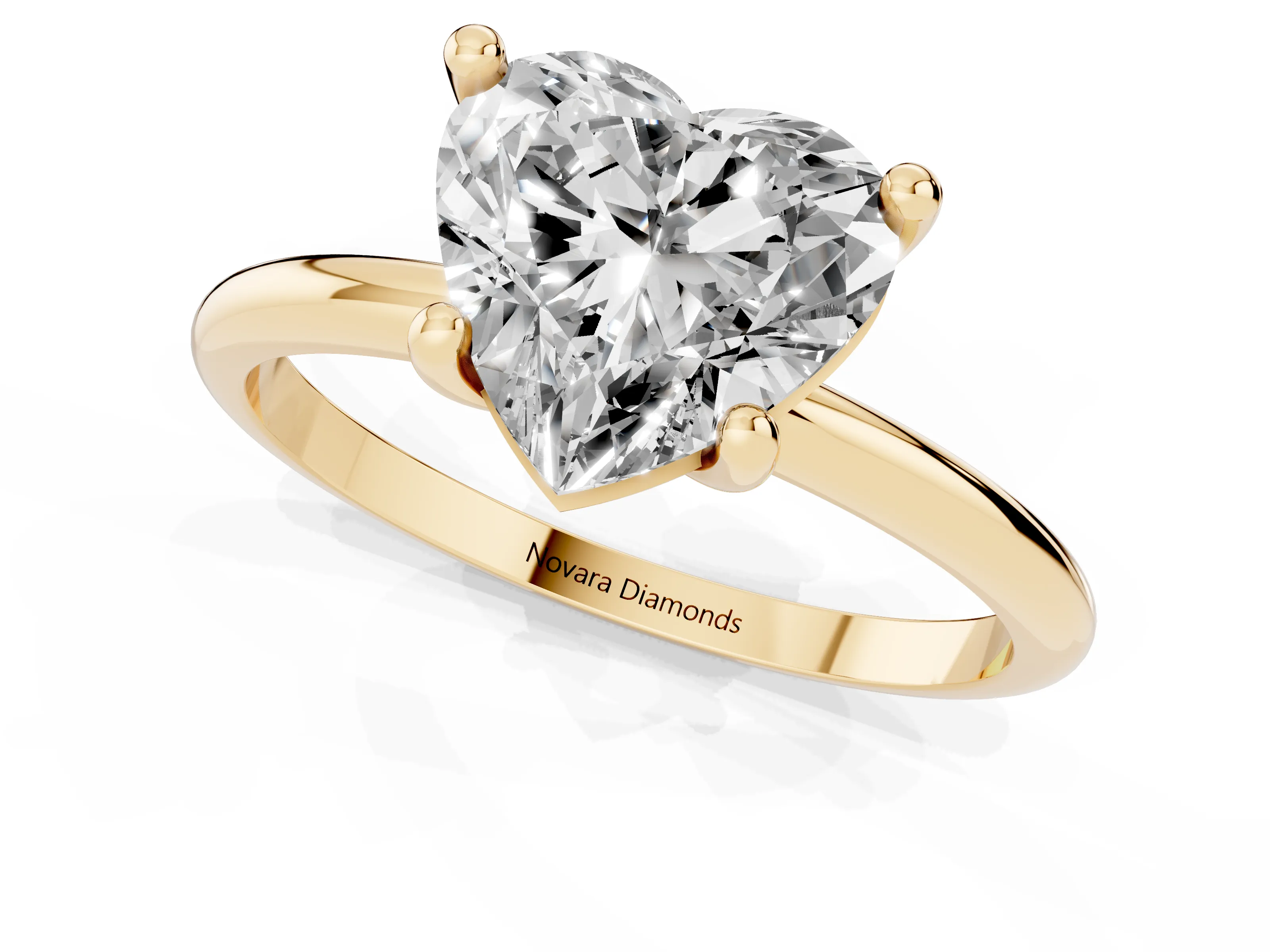 Heart Cut Diamond Solitaire Ring Set in Yellow gold with Secure Prong Setting on a Classic Band