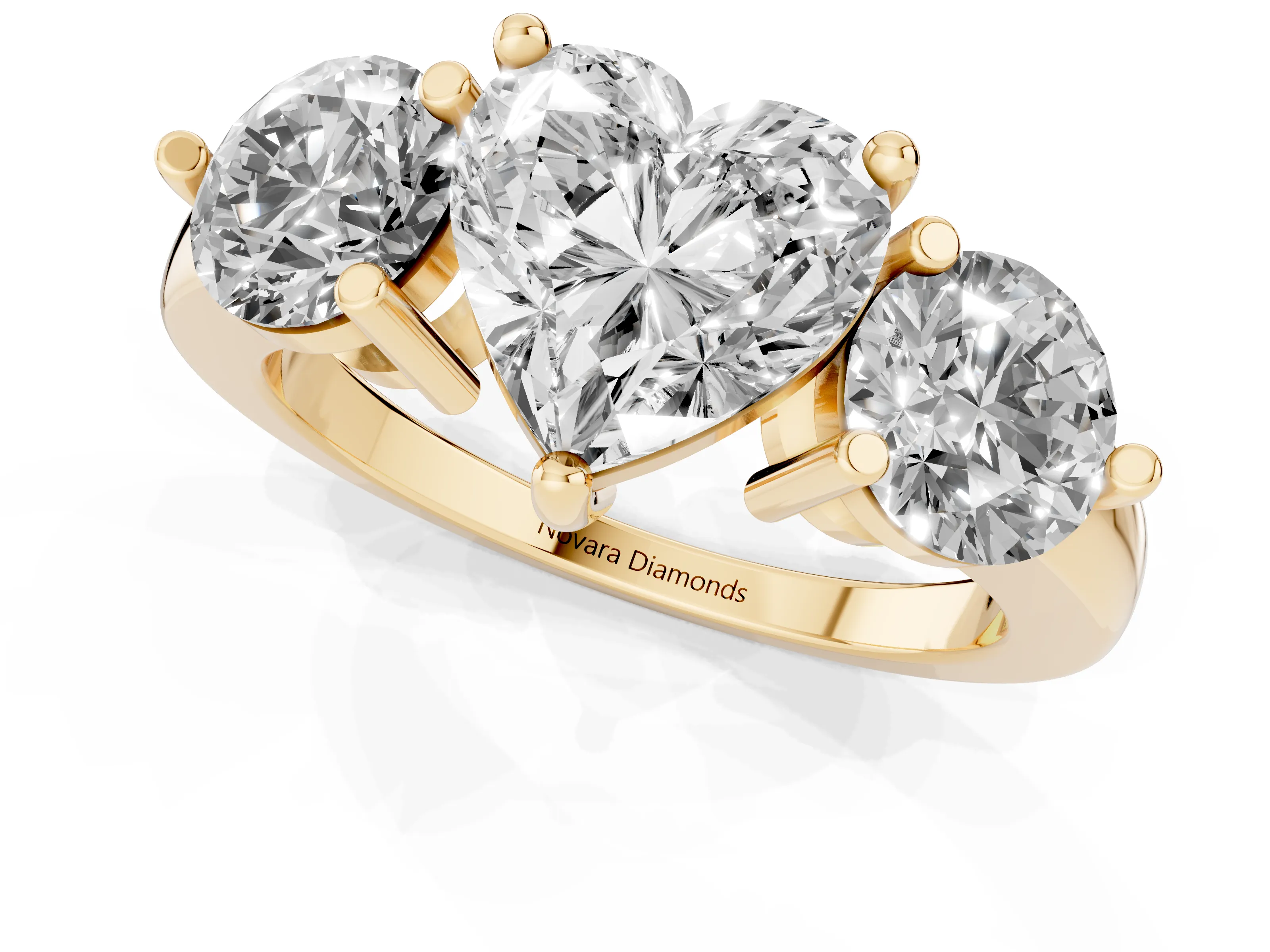 Heart Cut Diamond Three-Stone Ring Set in Yellow gold with Prong Setting and Classic Band