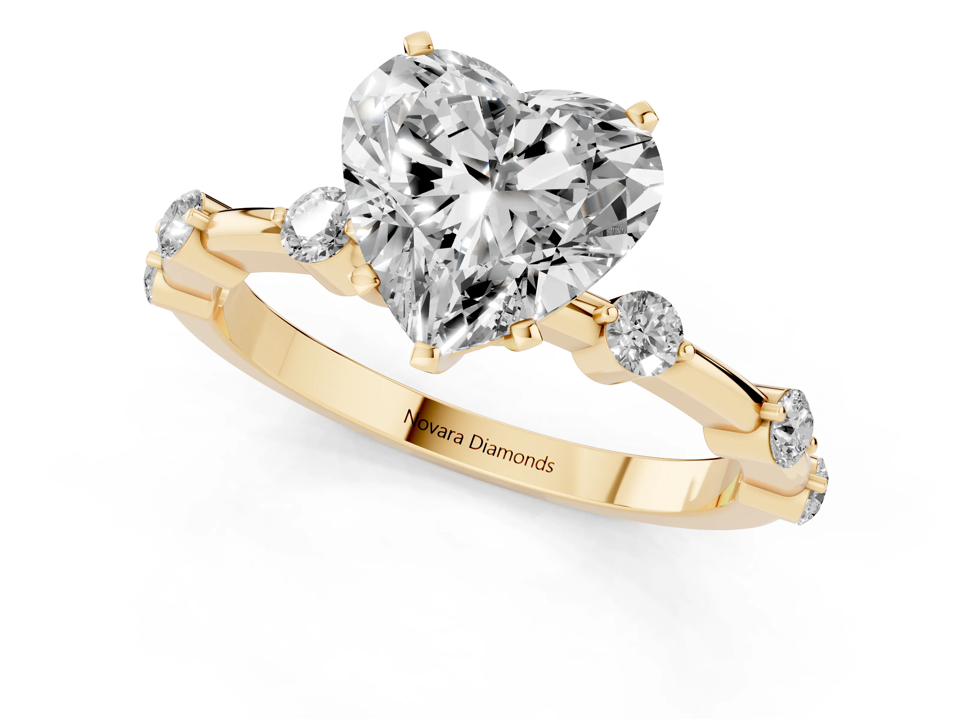 Heart Cut Diamond Solitaire Ring Set in Yellow gold with Bezel Set Side Stones and Prong Setting