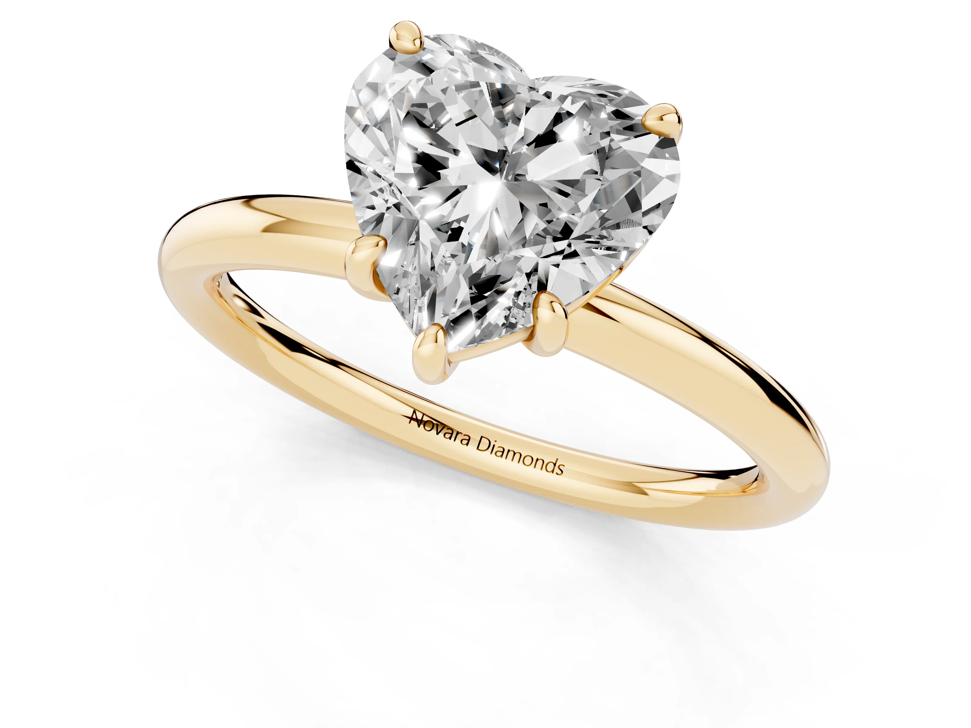 Heart Cut Diamond Solitaire Ring Set in Yellow gold with Prong Setting on a Polished Plain Band