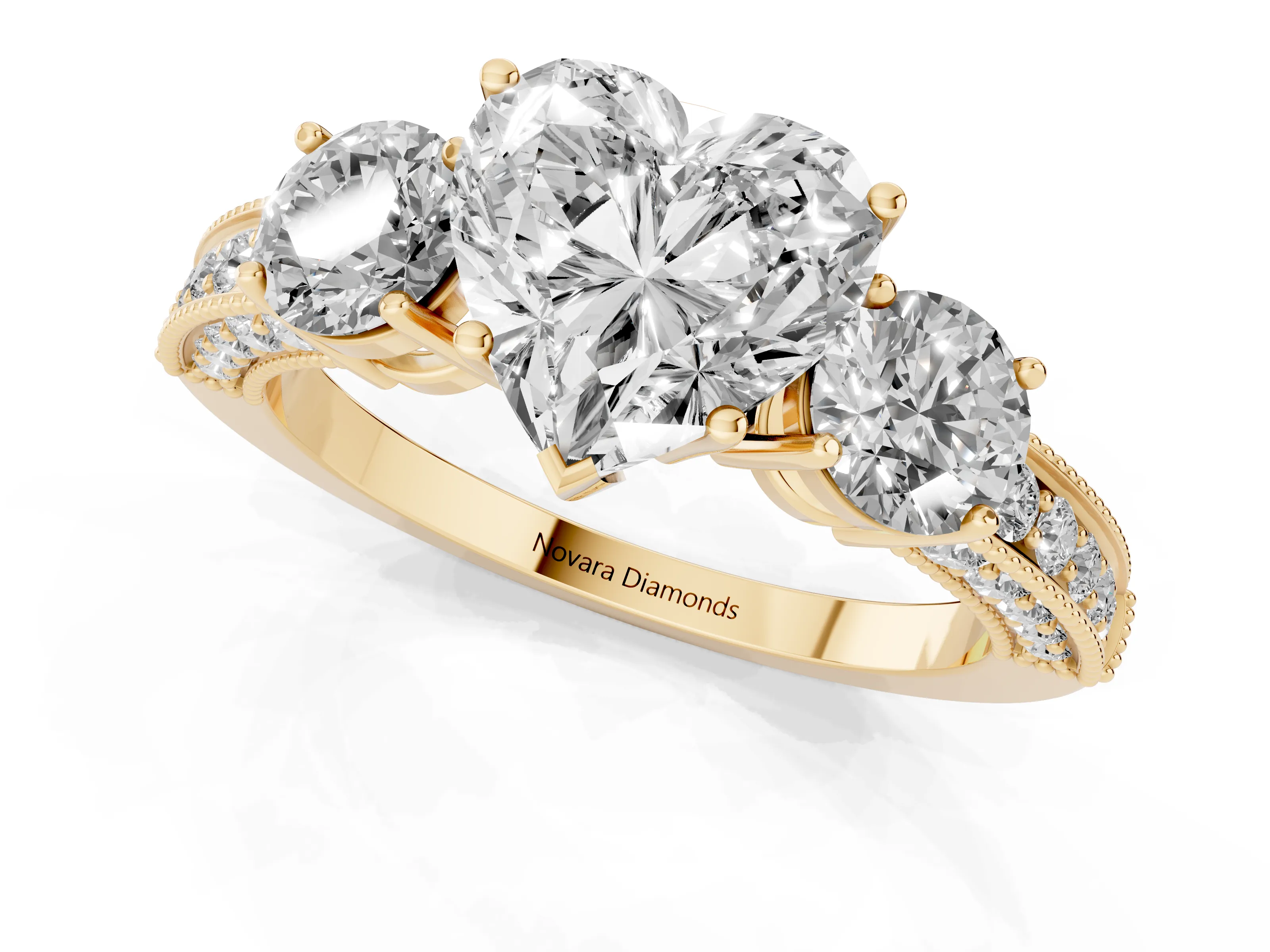 Heart Cut Diamond Three-Stone Ring Set in Yellow gold with Round Side Stones and Pavé Band