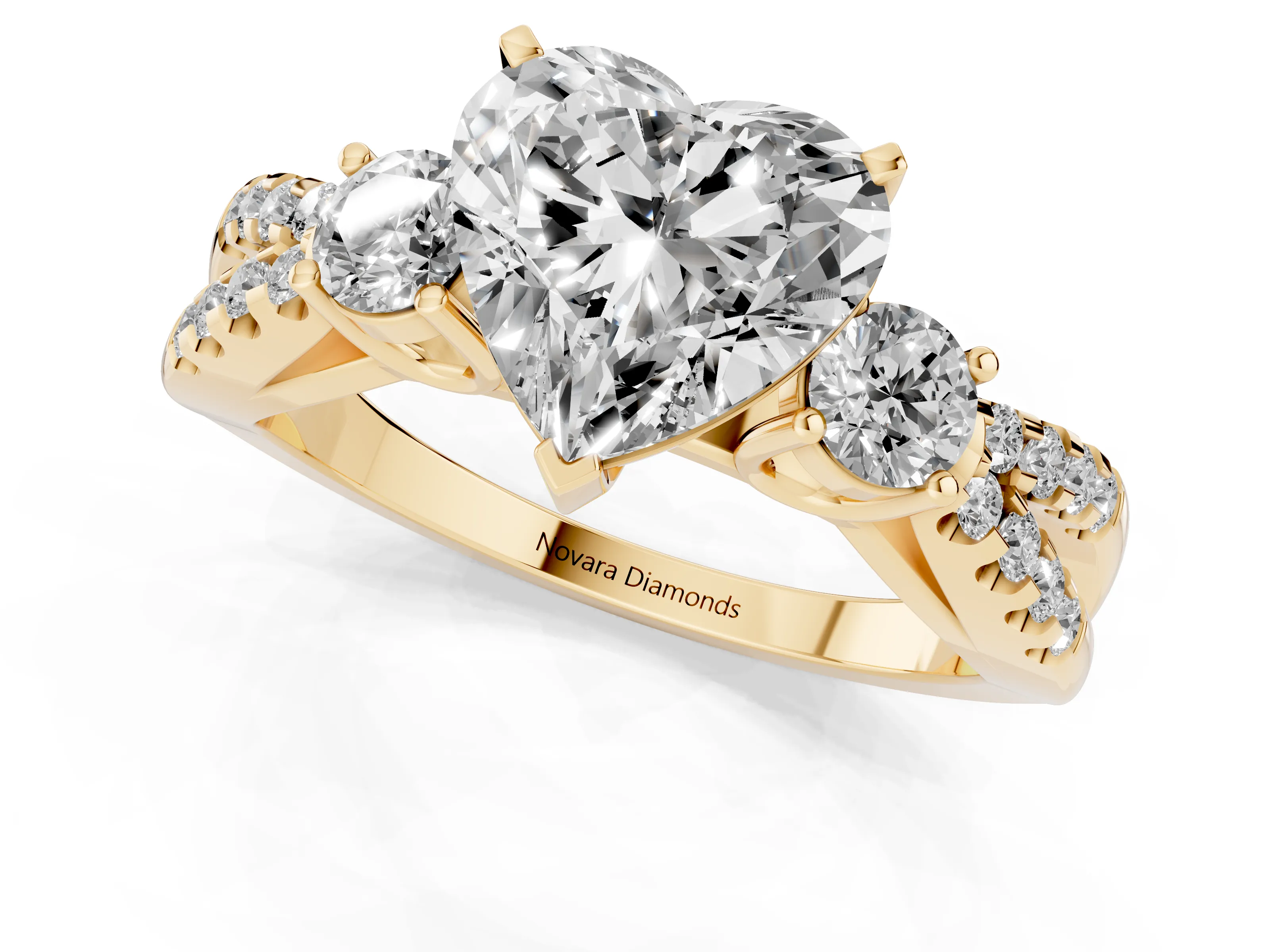 Heart Cut Diamond Three-Stone Ring Set in Yellow gold with Pavé Split Shank and Prong Setting