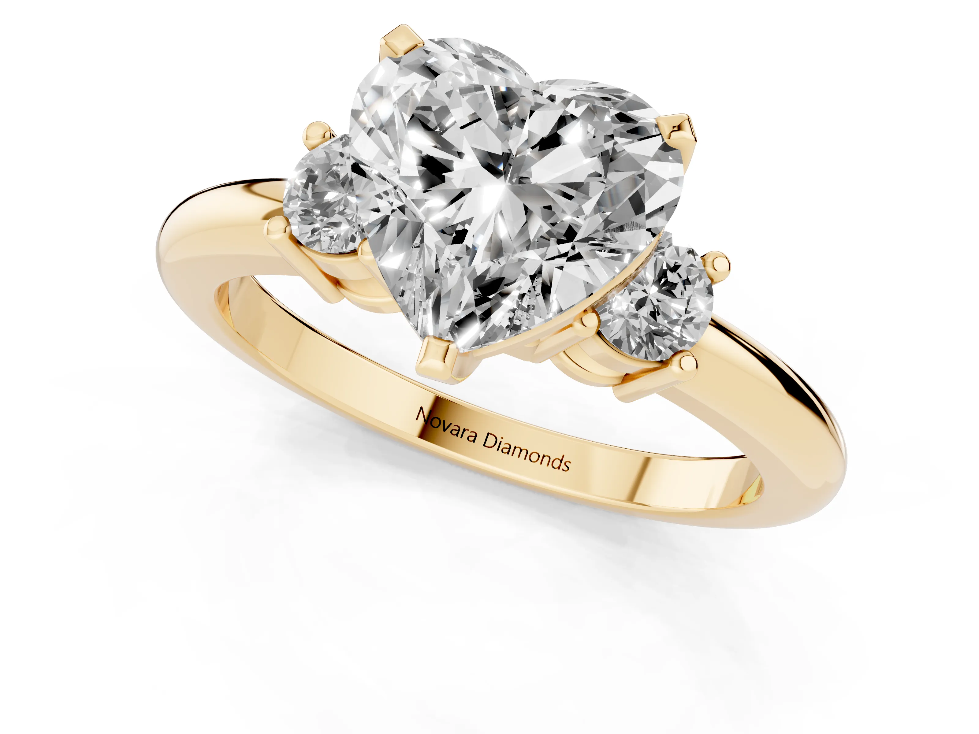 Three-Stone Heart Cut Diamond Ring Set in Yellow gold with Prong Setting and Plain Band
