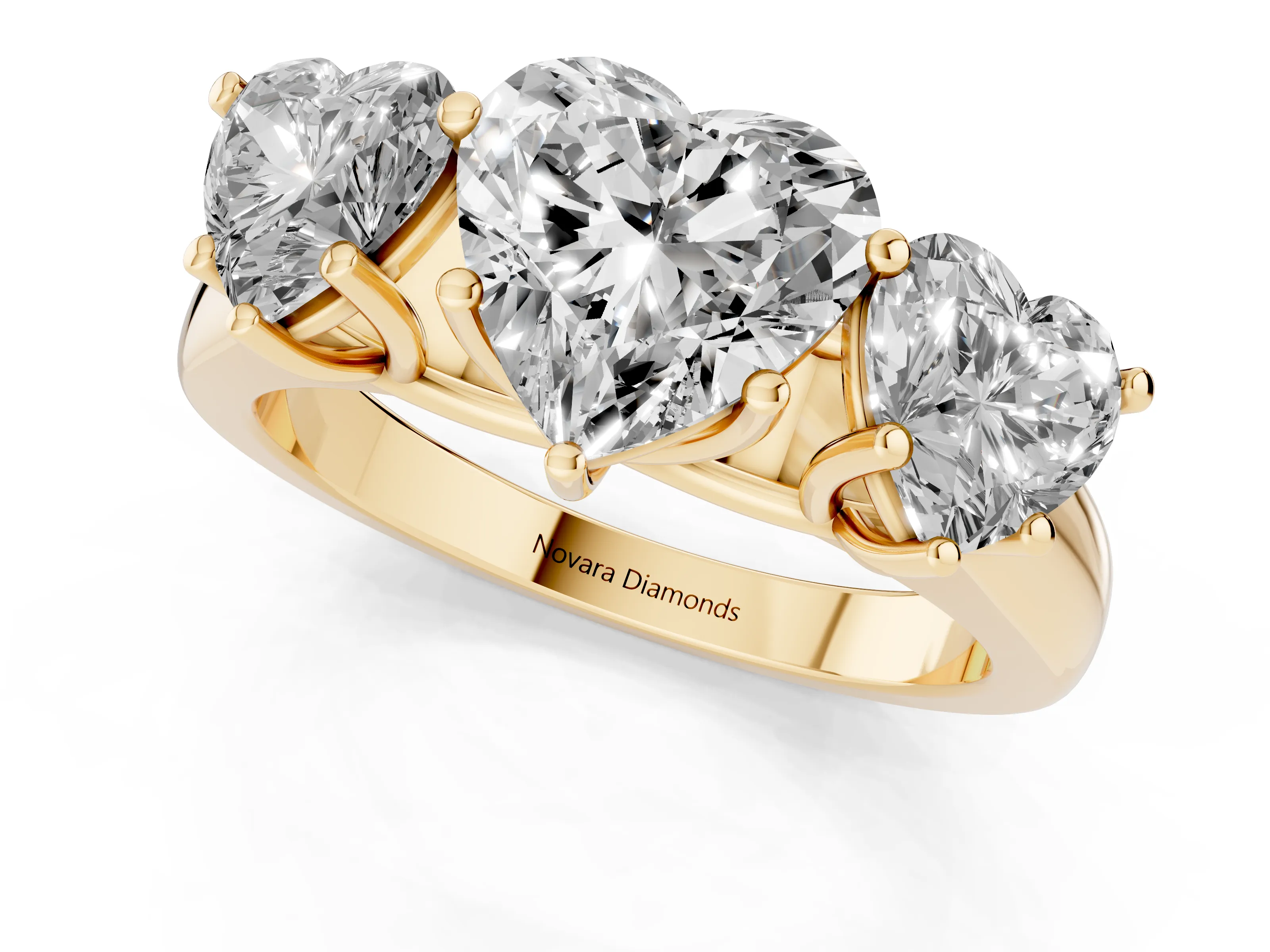 Heart Cut Diamond Three-Stone Ring Set in Yellow gold with Plain Polished Band