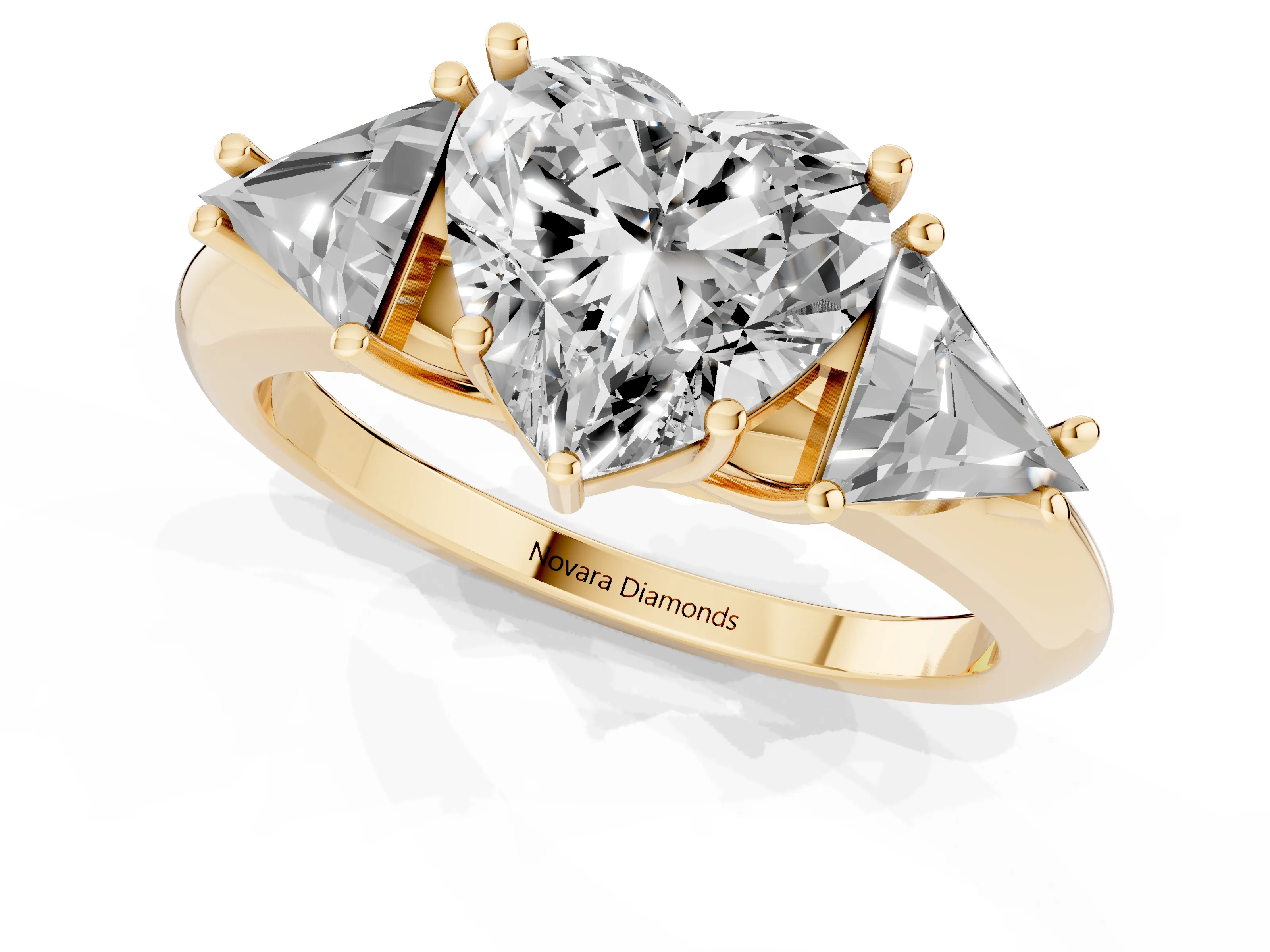 Heart Cut Diamond Three-Stone Engagement Ring Set in Yellow gold with Trillion Side Stones
