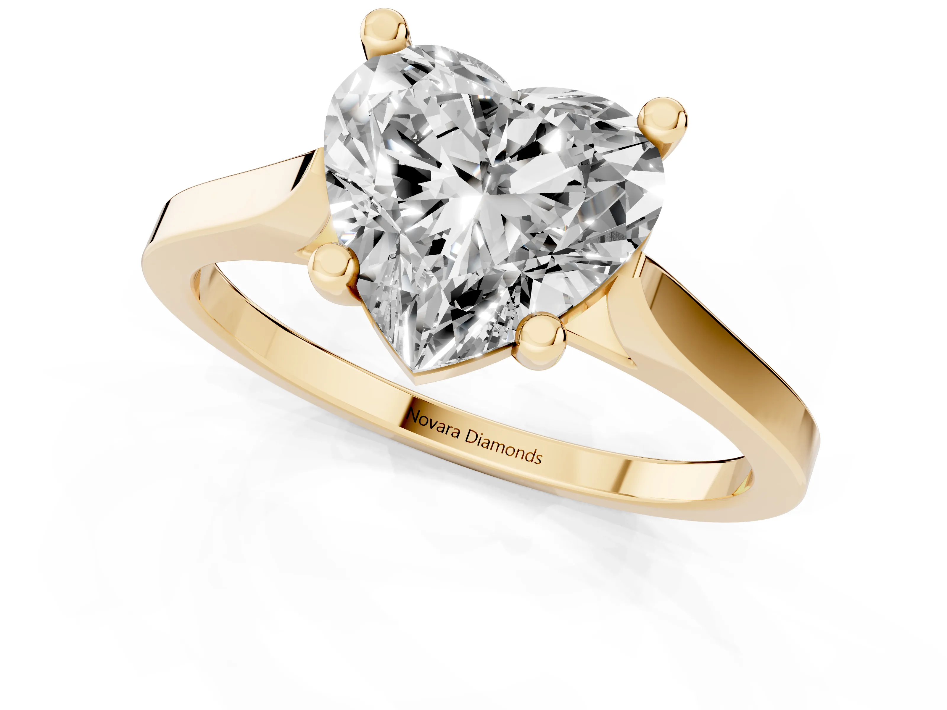 Heart Cut Diamond Solitaire Ring Set in Yellow gold with Prong Setting and Tapered Band