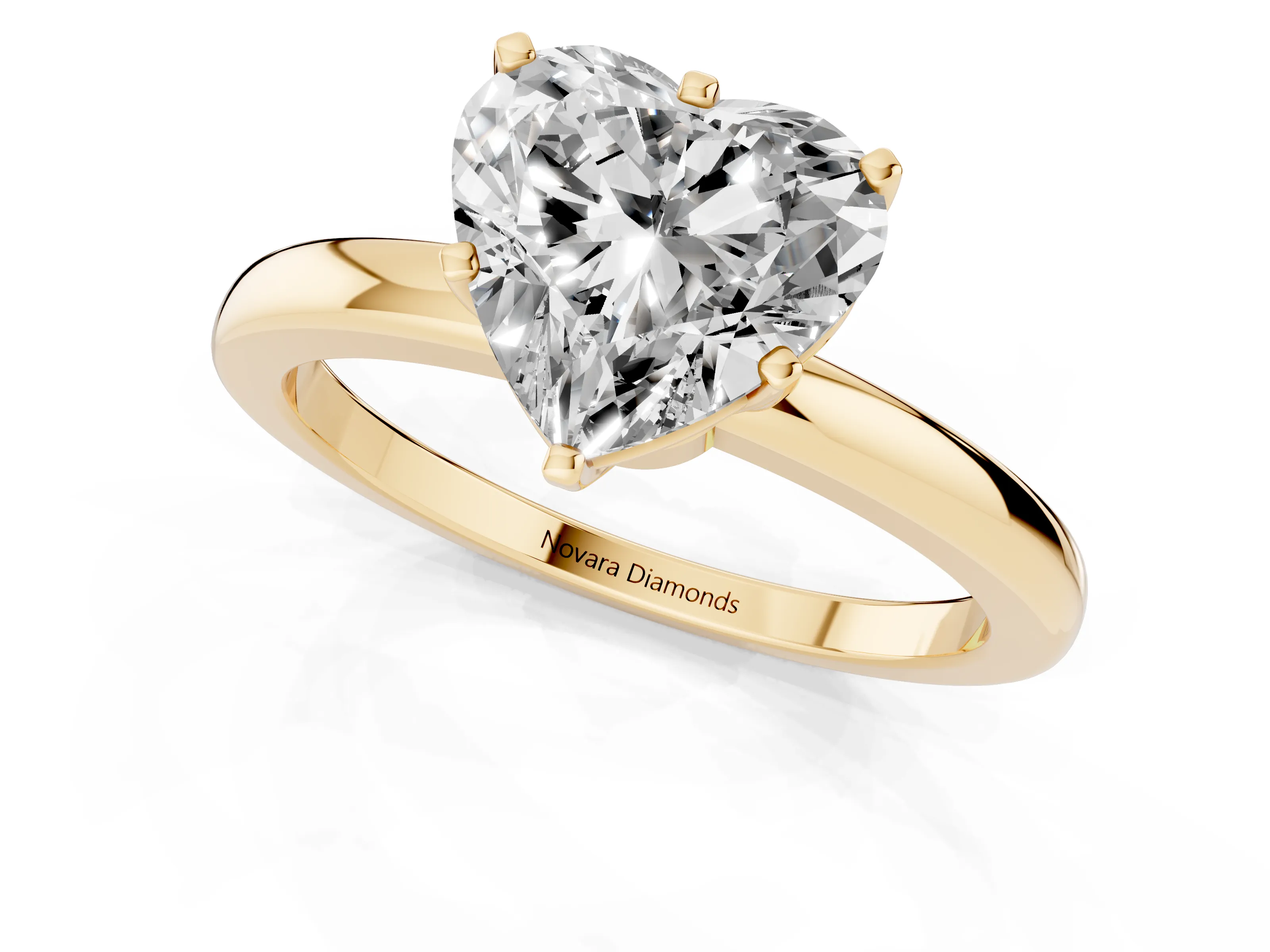 Heart Cut Diamond Solitaire Ring Set in Yellow gold with Raised Prong Setting on a Classic Band