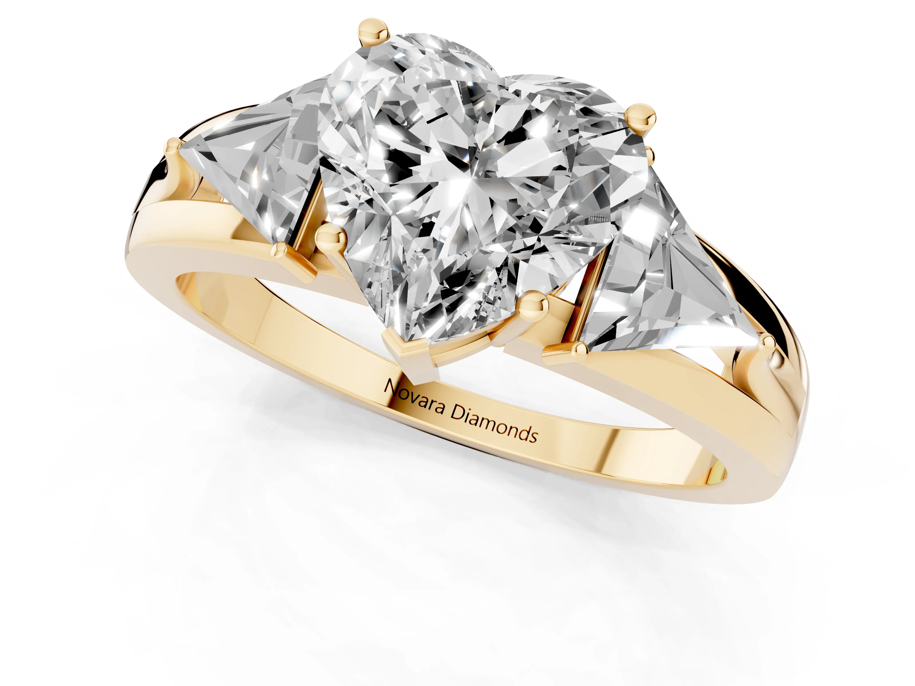 Heart Cut Diamond Three-Stone Ring Set in Yellow gold with Trillion Side Stones and Split Shank