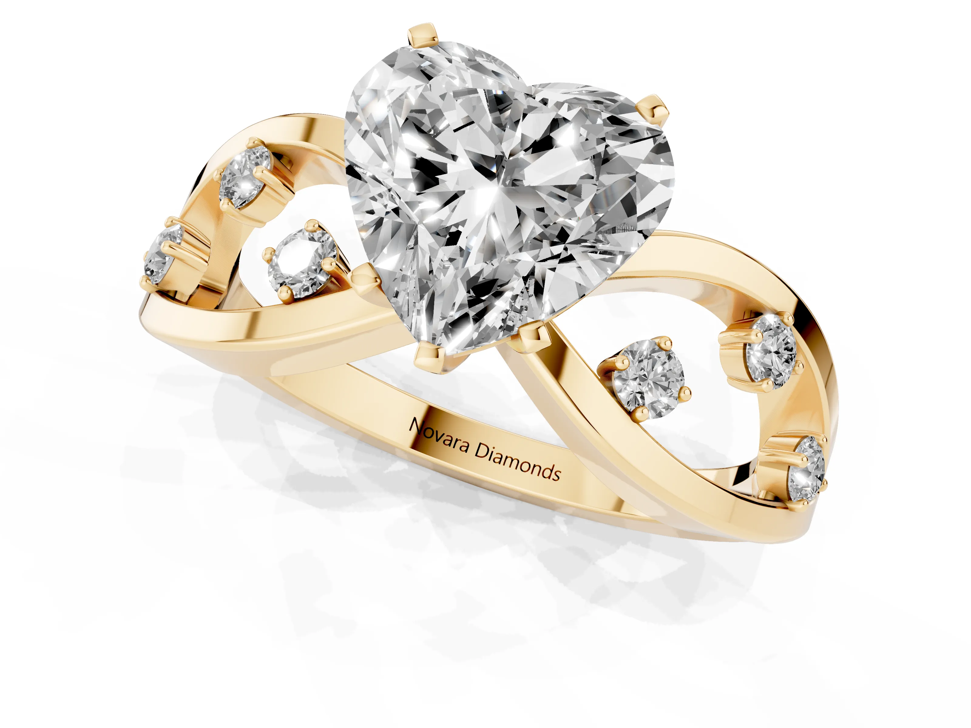Heart Cut Diamond Solitaire Ring Set in Yellow gold with Side Stones on Criss-Cross Band and Prong Setting
