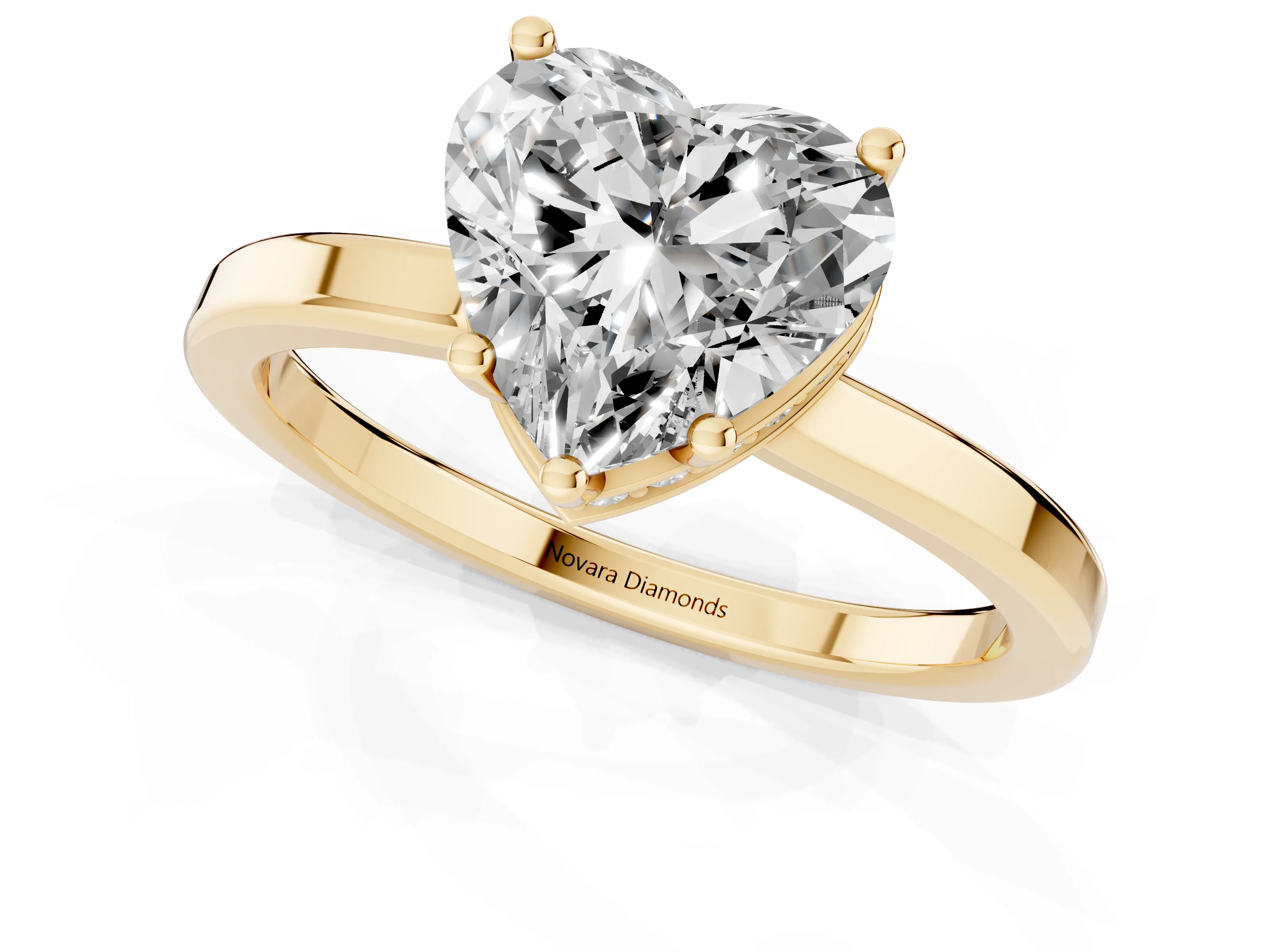 Heart Cut Diamond Solitaire Engagement Ring Set in Yellow gold with Prong Setting on a Plain Band