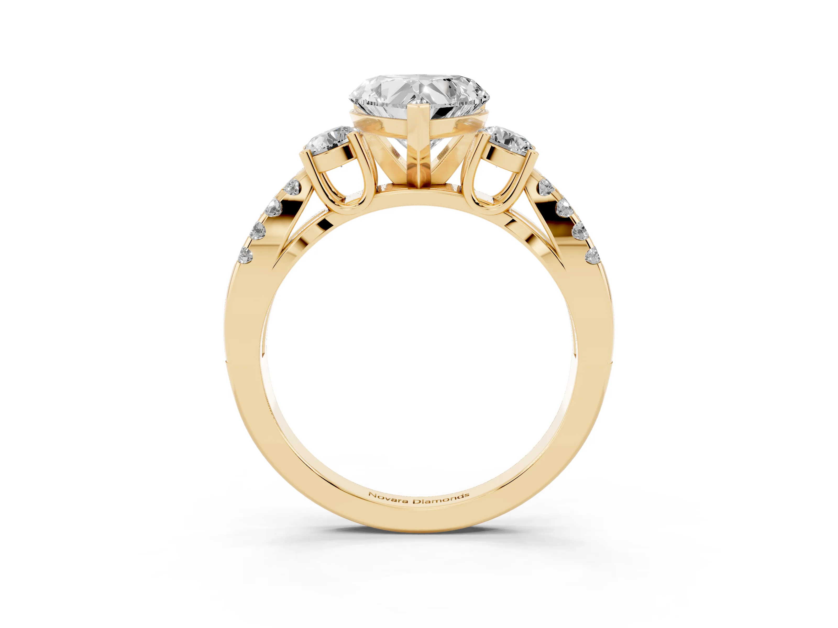 Heart Cut Diamond Three-Stone Ring Set in Yellow gold with Pavé Split Shank and Prong Setting