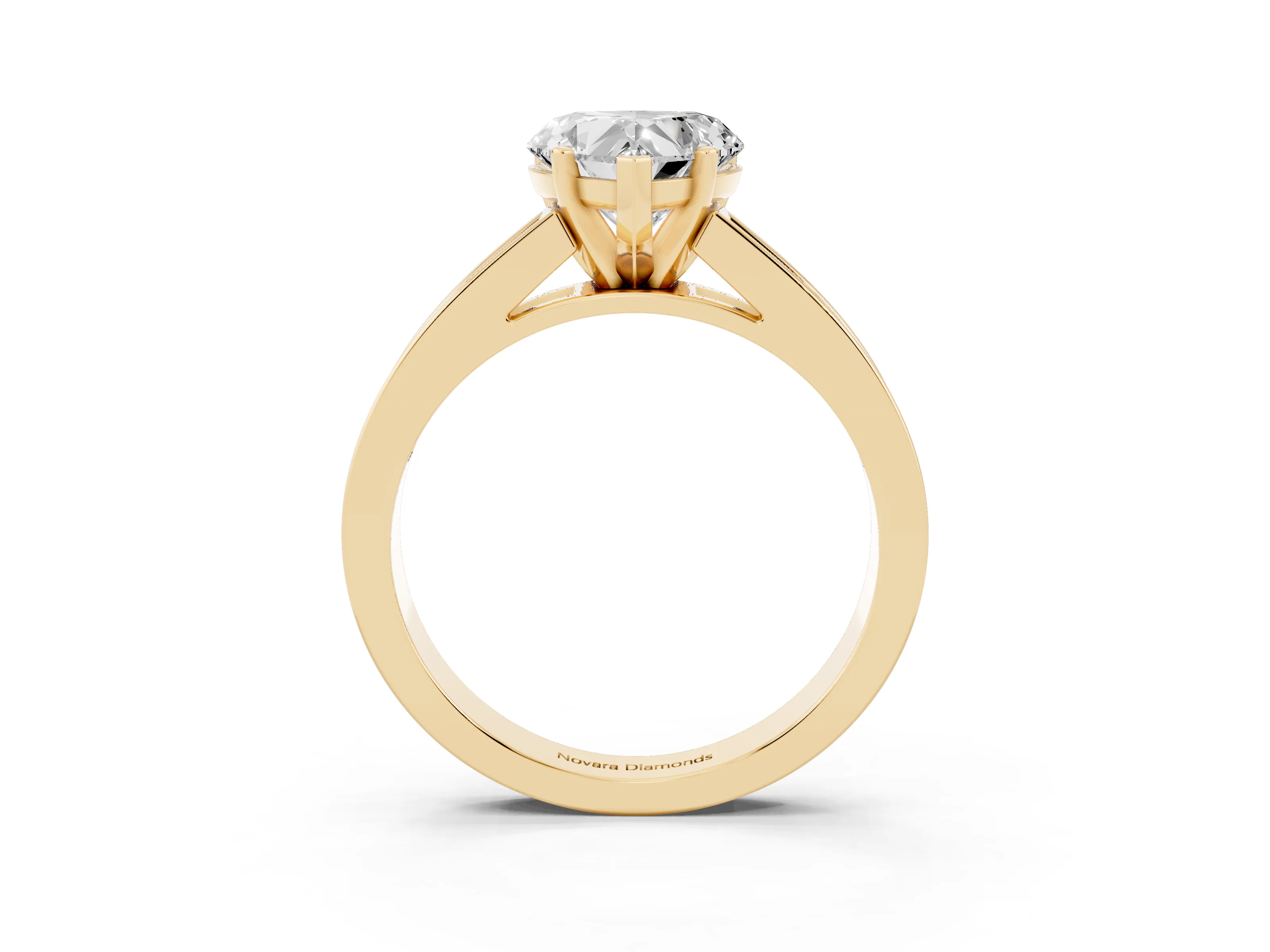 Heart Cut Diamond Solitaire Ring Set in Yellow gold with Channel-Set Band and Prong Setting
