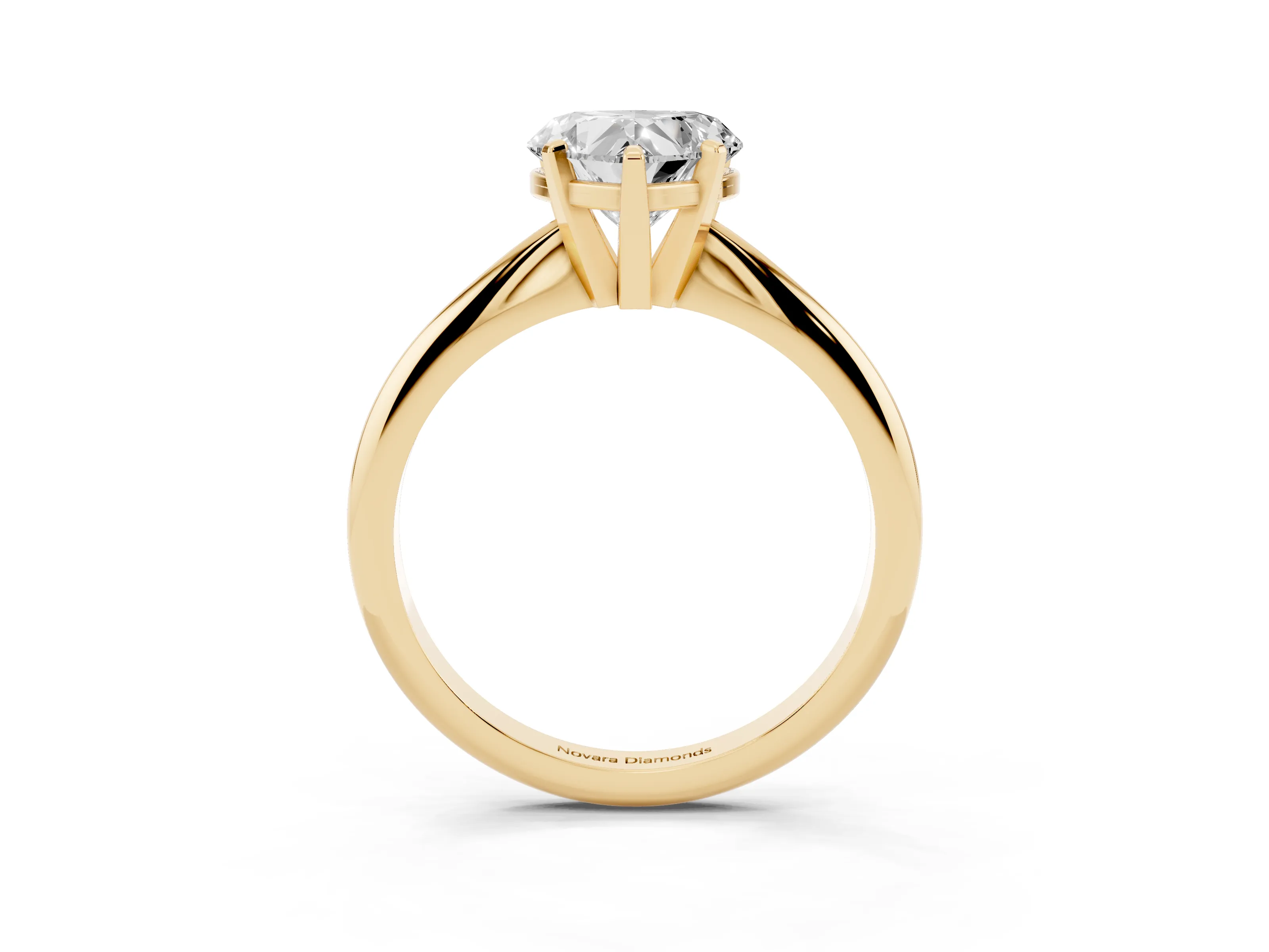 Heart Cut Diamond Solitaire Ring Set in Yellow gold with Prong Setting on a Plain Round Band