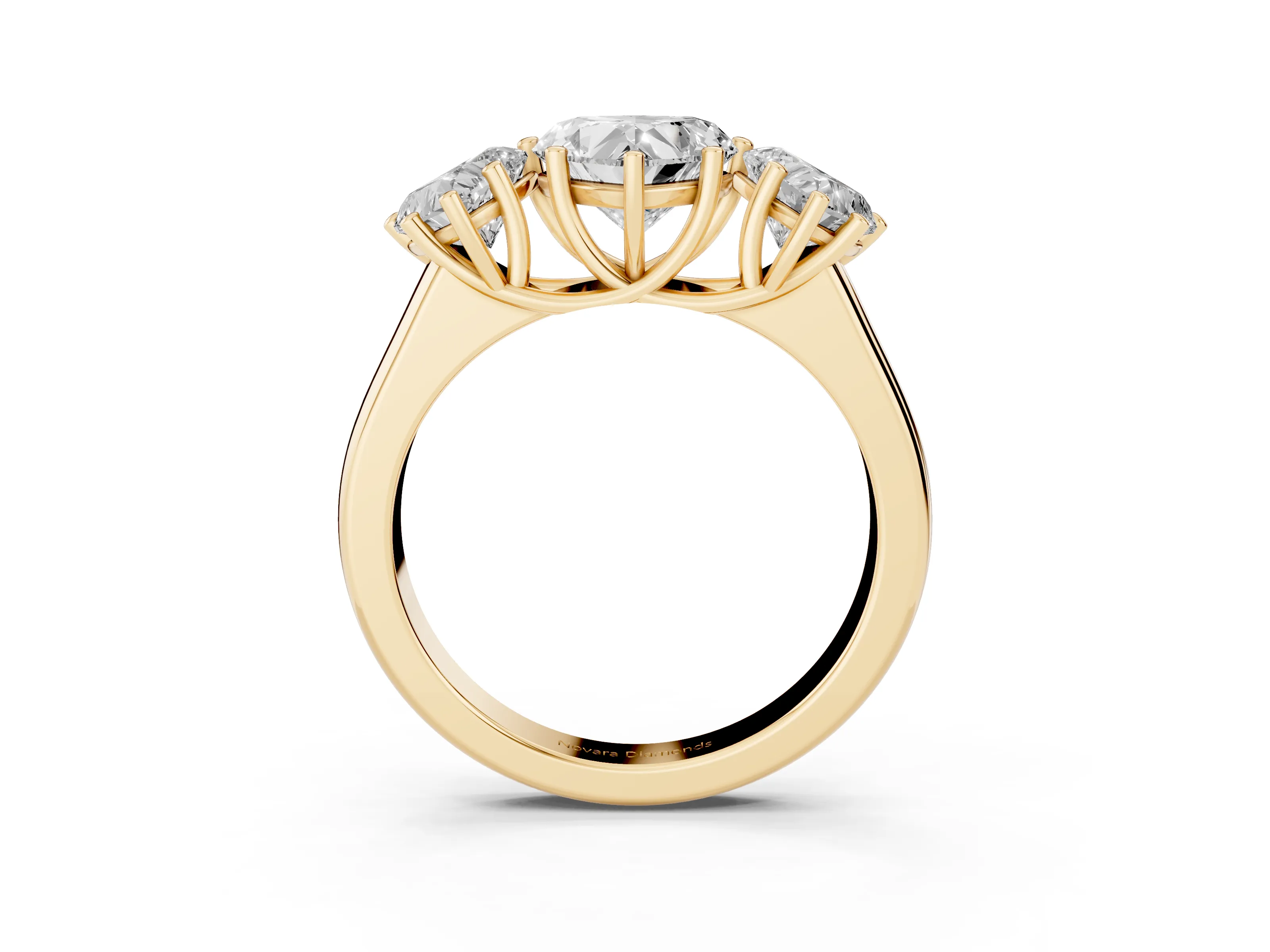 Heart Cut Diamond Three-Stone Ring Set in Yellow gold with Plain Polished Band