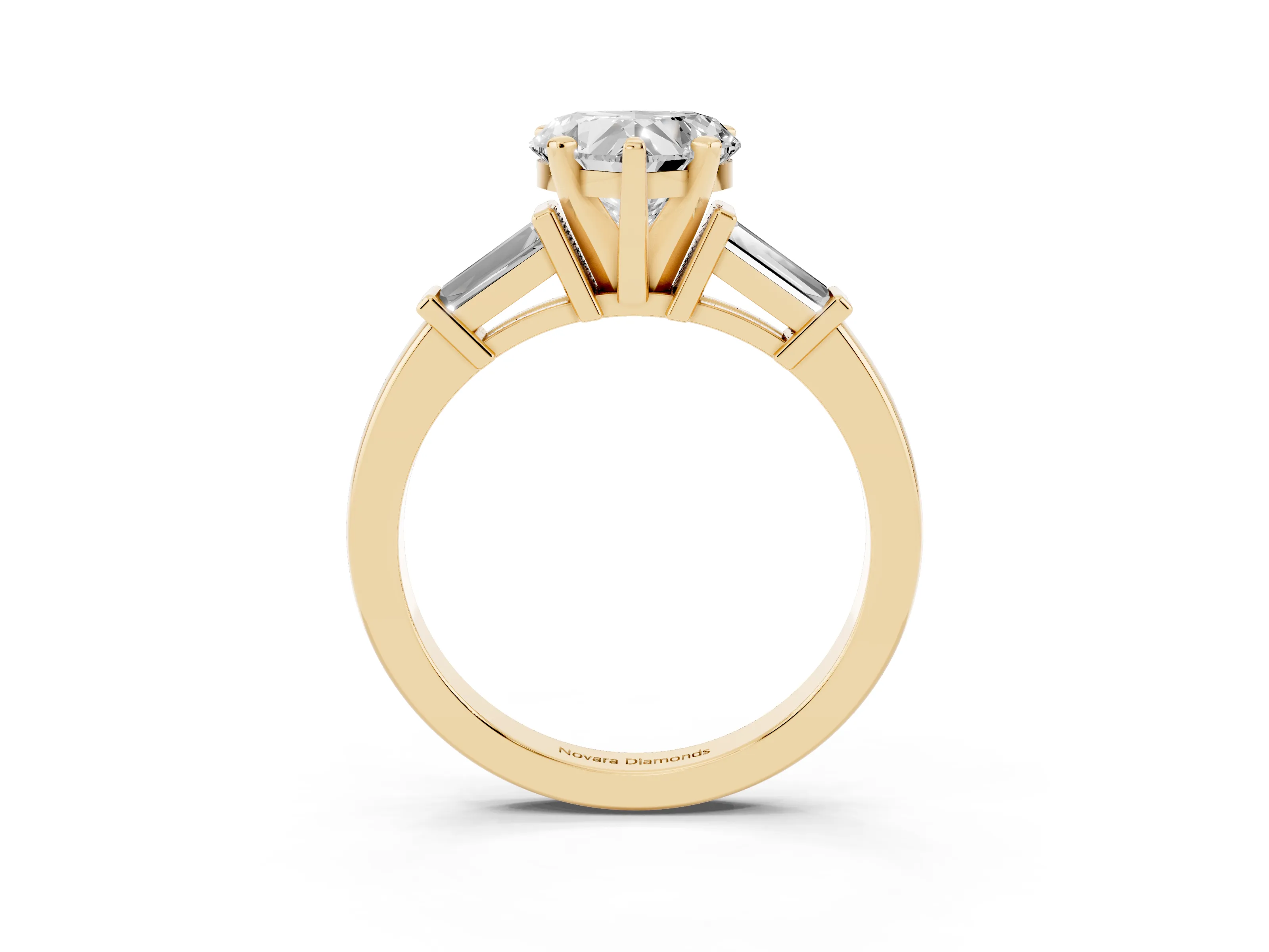 Heart Cut Diamond Solitaire Ring Set in Yellow gold with Tapered Baguette Accents and Prong Setting