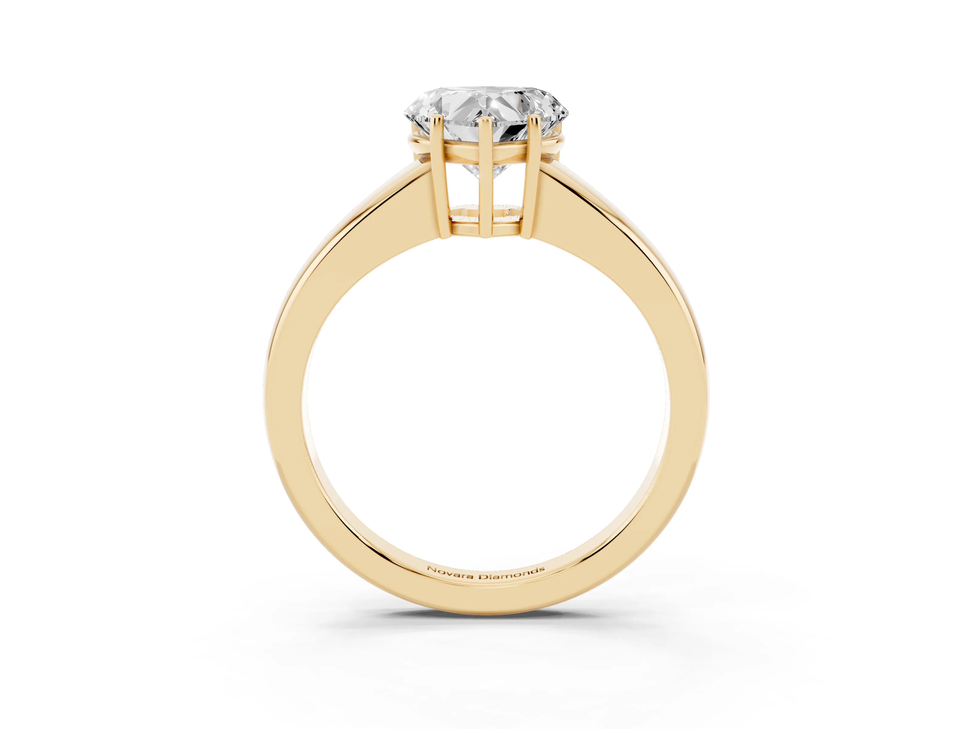 Heart Cut Diamond Solitaire Ring Set in Yellow gold with Tapered Band and Prong Setting